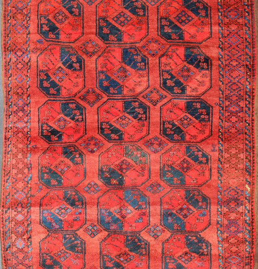 Ersari rug Medium sized hand - knotted rug with a red background with navy blue accents, cased within an intricate border and Gul design within the field. Circa 1940, Turkomen sub geometric, Keivan Woven Arts, rug R20 - 0604 Measurement 7'3... - Keivan Woven ArtsR20 - 0604 - 12946Rug