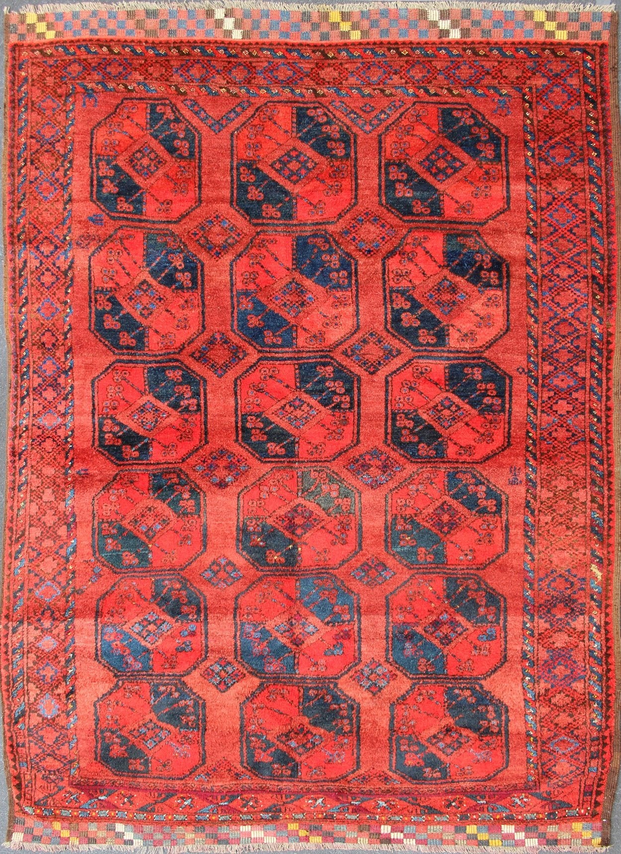Ersari rug Medium sized hand - knotted rug with a red background with navy blue accents, cased within an intricate border and Gul design within the field. Circa 1940, Turkomen sub geometric, Keivan Woven Arts, rug R20 - 0604 Measurement 7'3... - Keivan Woven ArtsR20 - 0604 - 12946Rug