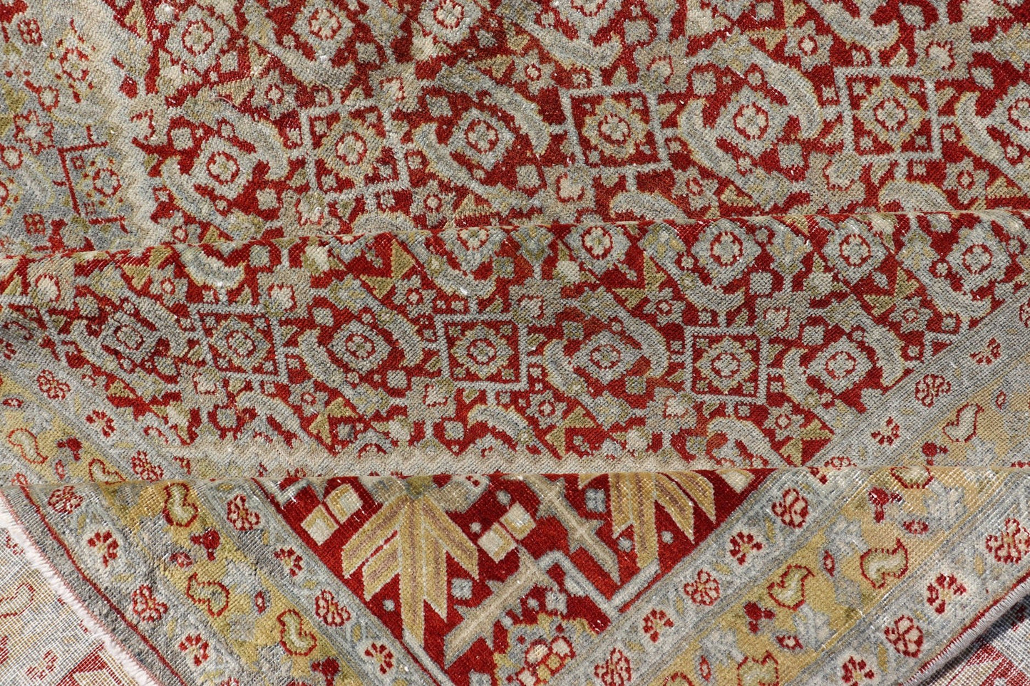 Antique Persian Tabriz Distressed Carpet With Geometric Diamond Design Beautiful red, soft green, tan, light blue, gray, yellow Geometric Persian Tabriz rug, rug R20 - 0722, country of origin / type: Iran / Tabriz, circa 1920. This antique Tabr... - Keivan Woven ArtsR20 - 0722 - 12960
