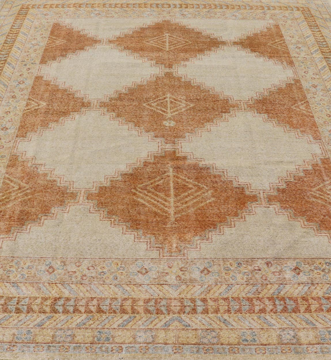 Distressed Modern Khotan Design Rug with Diamond & Geometric Pattern In Ivory, Burnt Orange, light green, light blue and yellow colors. Keivan Woven Arts/ rug RJK - 24848 - JPR - 011 - 01 country of origin / type: India / Khotan 21st Century. Measures: ... - Keivan Woven ArtsRJK - 24848 - JPR - 011 - 01 - 21535Rug