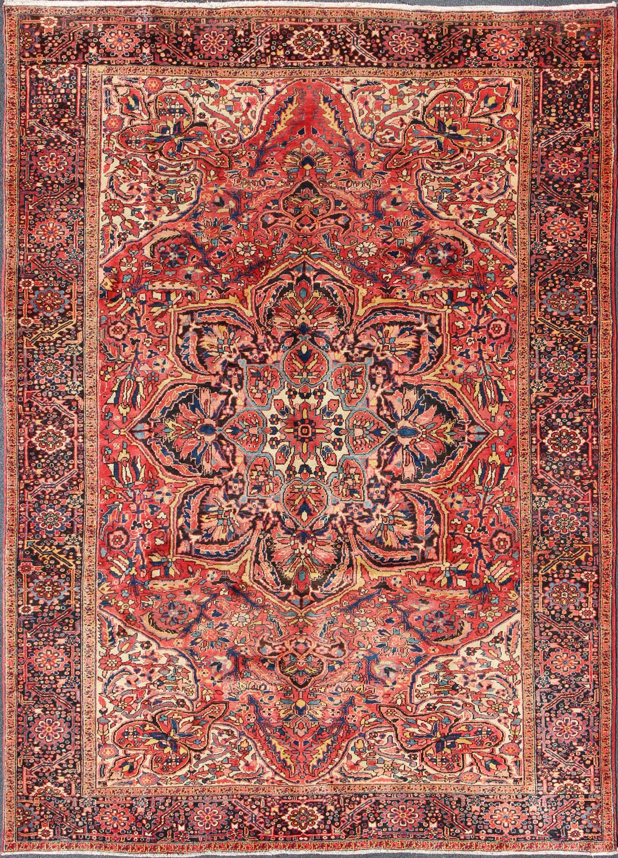 Large Semi antique Heriz with soft reds and multi - color midcentury Persian Heriz rug with stylized medallion design, rug rm - m17420, country of origin / type: Iran / Heriz, circa 1950. This magnificent antique Persian Heriz carpet from the mid - 20... - Keivan Woven ArtsRM - M17420 - 2163Rug