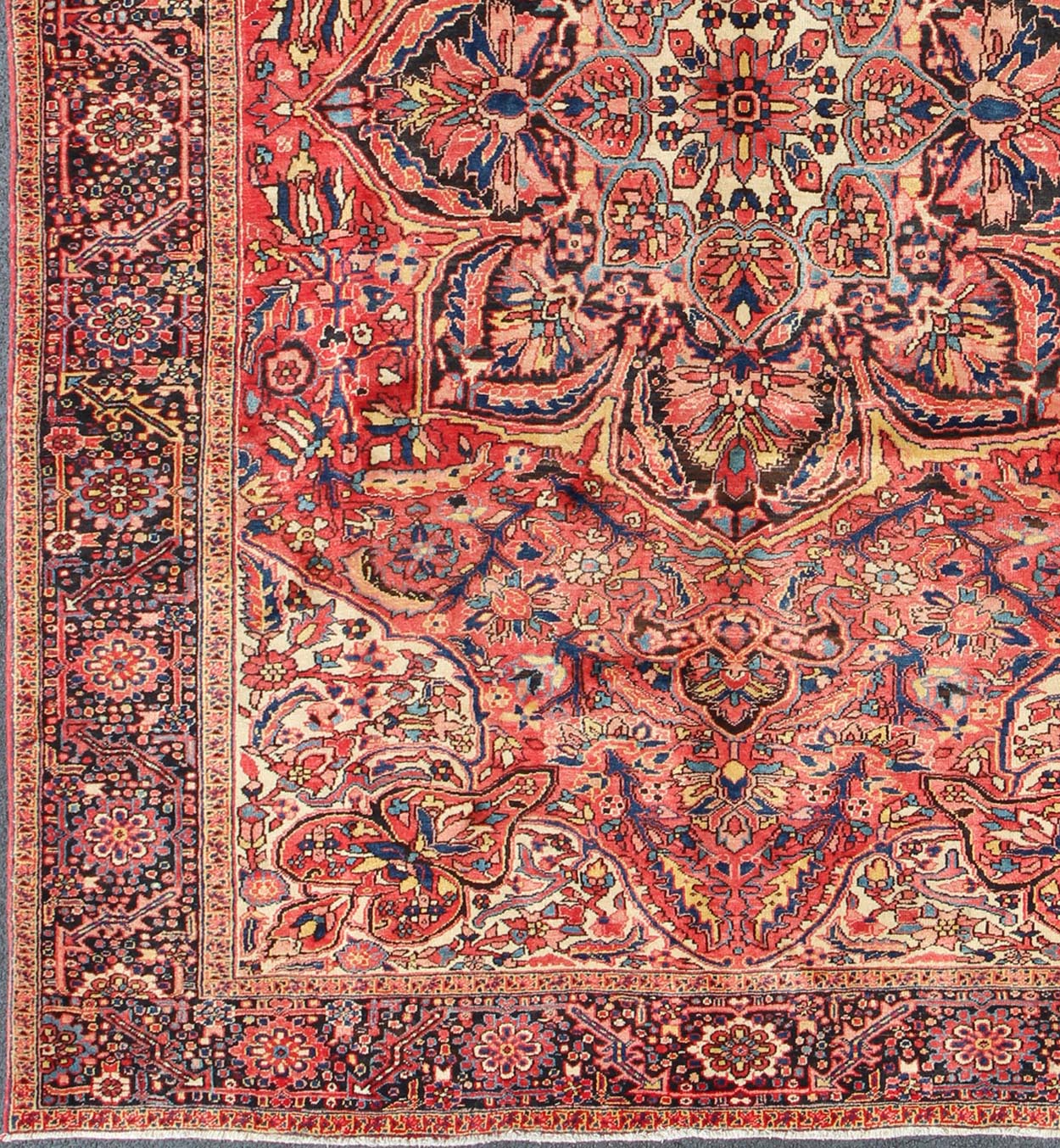 Large Semi antique Heriz with soft reds and multi - color midcentury Persian Heriz rug with stylized medallion design, rug rm - m17420, country of origin / type: Iran / Heriz, circa 1950. This magnificent antique Persian Heriz carpet from the mid - 20... - Keivan Woven ArtsRM - M17420 - 2163Rug