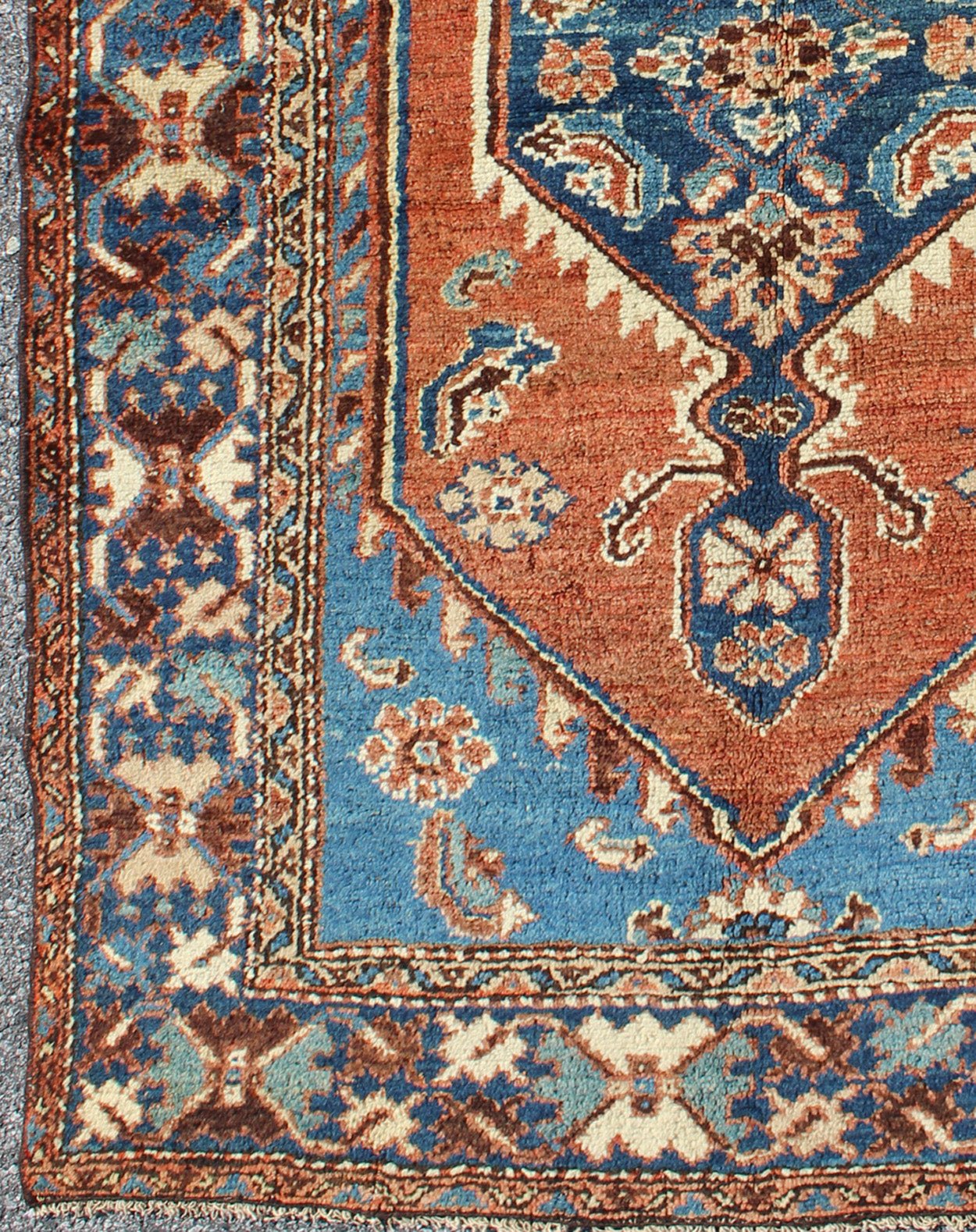 Antique Persian Karadjeh rug with tribal medallion in rust red and bright blue, rugs 12 - 0104, country of origin / type: Iran / Karadjeh, circa 1910. This early 20th century, handwoven antique Persian Karadjeh rug features a rust red - colored fiel... - Keivan Woven ArtsS12 - 0104 - 3223Rug