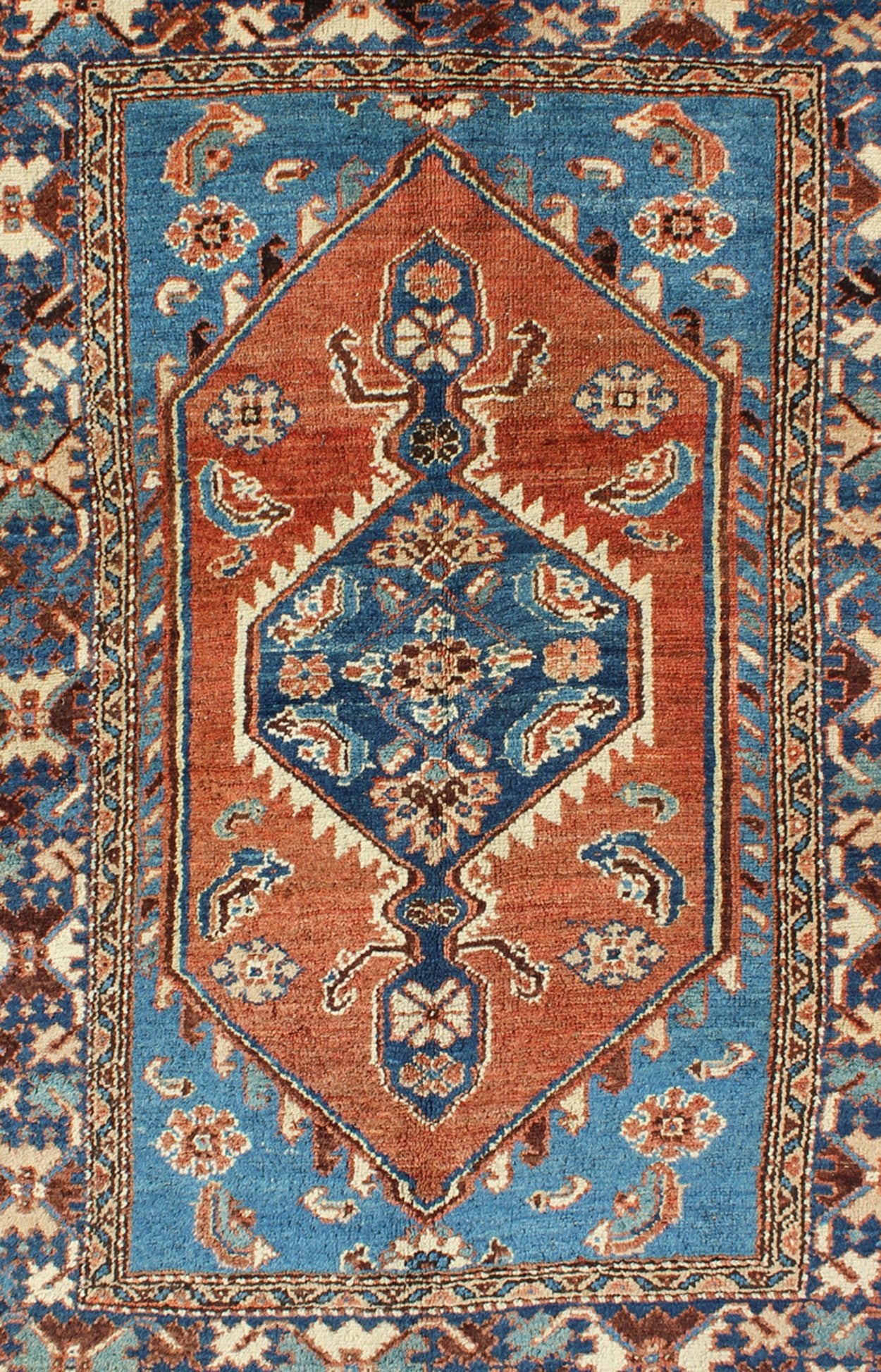 Antique Persian Karadjeh rug with tribal medallion in rust red and bright blue, rugs 12 - 0104, country of origin / type: Iran / Karadjeh, circa 1910. This early 20th century, handwoven antique Persian Karadjeh rug features a rust red - colored fiel... - Keivan Woven ArtsS12 - 0104 - 3223Rug