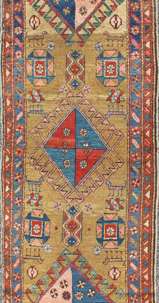 Antique Persian Serapi Runner with Gold Background This antique Serapi - Heriz displays a charming and rich combination of various jewel colors. The geometric diamond shapes are repeated in different forms and colors throughout the background, whi... - Keivan Woven ArtsS12 - 0704 - 3315