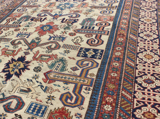 Antique Caucasian Prepedil Rug - This magnificent antique Caucasian Prepedil rug displays a superb Caucasian arabesque accompanied by symbolic devices and protective borders. Crenellated fence guard - bands wind around the perimeter of the field along with... - Keivan Woven ArtsS12 - 0913 - 3674