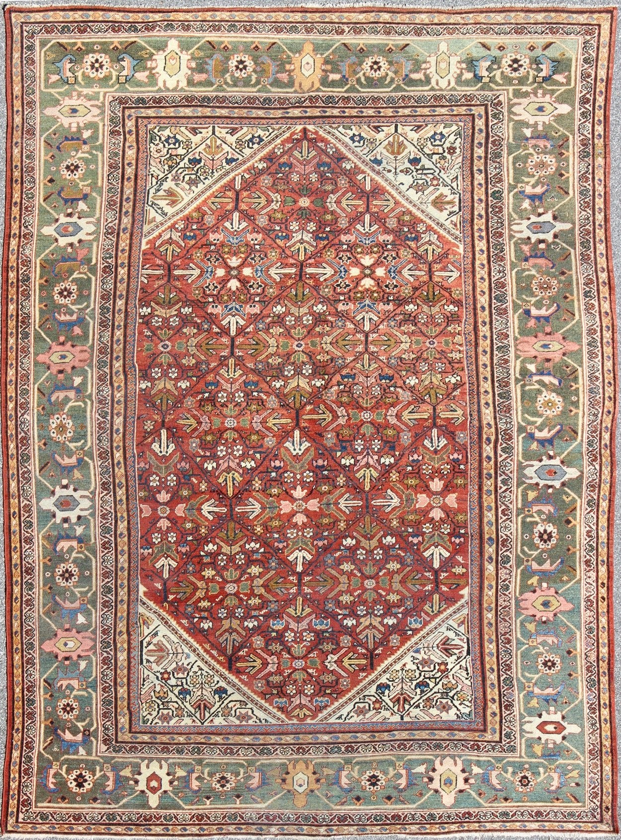 Antique Persian Sultanabad Rug The expansive terra - cotta red background of this piece consists of an intricate all - over design surrounded by a wide green border with ample motifs. Delicate vine - scrolls and sub - geometric elements emphasize the ae... - Keivan Woven ArtsS12 - 1212 - 4720Rug