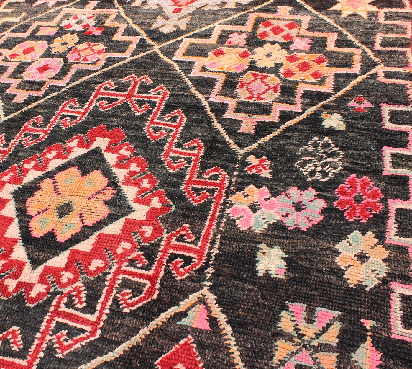 Geometric Tribal Vintage Moroccan Rug in Black, Red, Green and Pink. Keivan Woven Arts / Mid 20th Century / Morocco / Rug SK - 373 With bold diamond and star medallions set on black background, this unique Moroccan displays an array of unexpected col... - Keivan Woven ArtsSK - 373 - 3994Rug