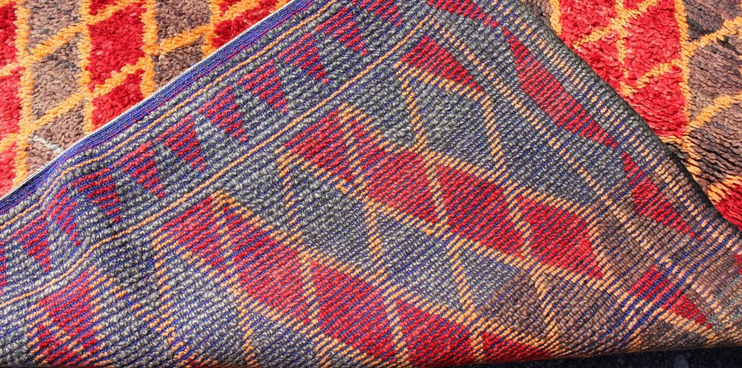 Midcentury Moroccan rug with orange, red, brown diamonds and blue fringe detail. Keivan Woven Arts / rug sk - 628, country of origin / type: Morocco / Tribal, circa mid - 20th century This wonderful vintage Moroccan rug (circa mid - 20th century) feat... - Keivan Woven ArtsSK - 628 - 4078Rug