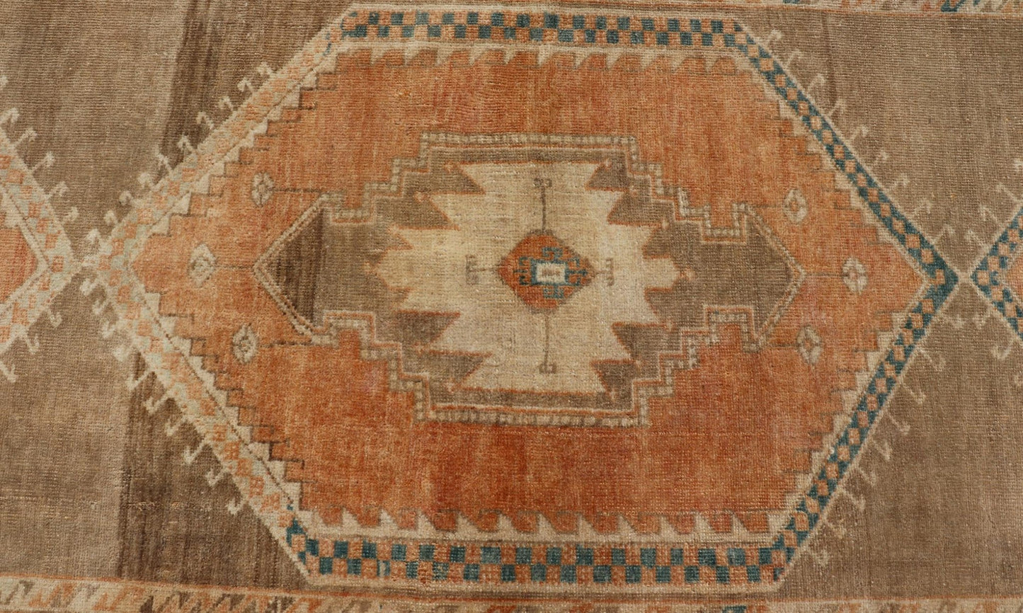 Measures: 3'6 x 13'0 Keivan Woven Arts Oushak Runner With Tribal and Geometric Motifs. Keivan Woven Arts / rug/SNK - 300, country of origin / type: Turkey / Oushak, circa 1940 This vintage runner features an assortment of tribal and geometric meda... - Keivan Woven ArtsSNK - 300 - 27658Rug
