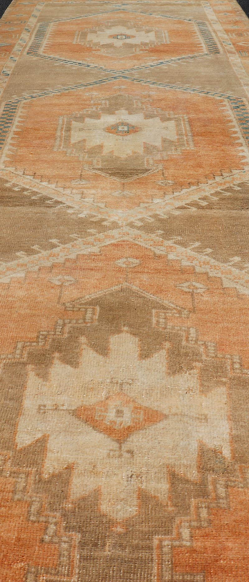 Measures: 3'6 x 13'0 Keivan Woven Arts Oushak Runner With Tribal and Geometric Motifs. Keivan Woven Arts / rug/SNK - 300, country of origin / type: Turkey / Oushak, circa 1940 This vintage runner features an assortment of tribal and geometric meda... - Keivan Woven ArtsSNK - 300 - 27658Rug
