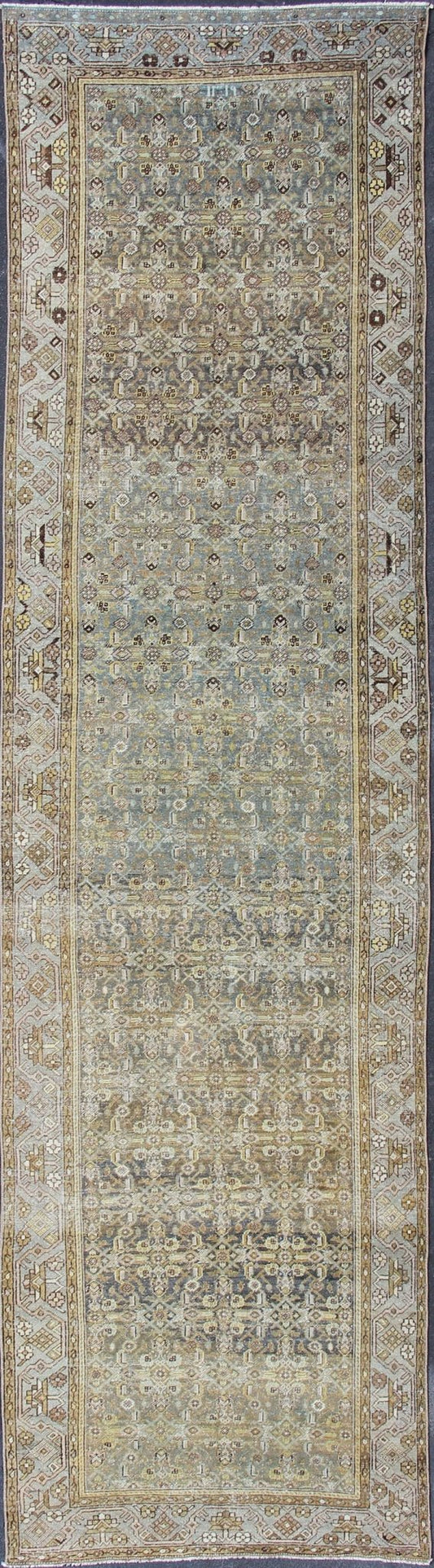 Wide and Long Antique Persian Malayer Runner with All - Over Design in Dark Gray. Rare Persian Malayer Antique wide runner with all - over Herati design in dark gray background and variation of blue, yellow green, light gray, soft yellow, rug SUS - 2007 - ... - Keivan Woven ArtsSUS - 2007 - 38 - 13056Rug