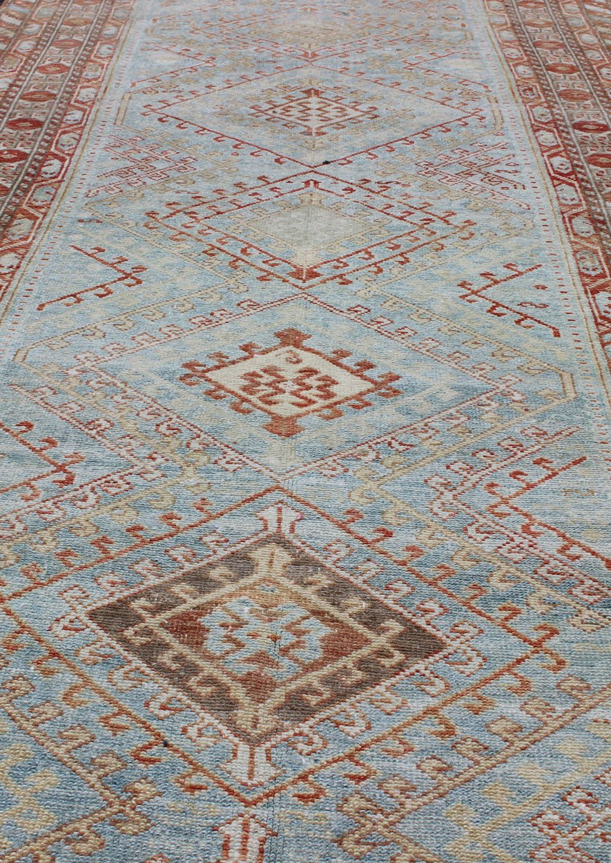 Light Blue and Soft Range Antique Persian Malayer Runner with Geometric Motifs Tribal design Persian antique Malayer runner in blue, red, orange, rug SUS - 2009 - 658, country of origin / type: Iran / Mahal, circa 1920 This antique Persian Ma... - Keivan Woven ArtsSUS - 2009 - 658 - 13314