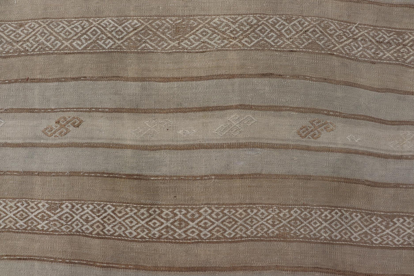 Vintage Turkish Kilim Rug with Subtle Earthy Tones and Intricate Geometric Patterns