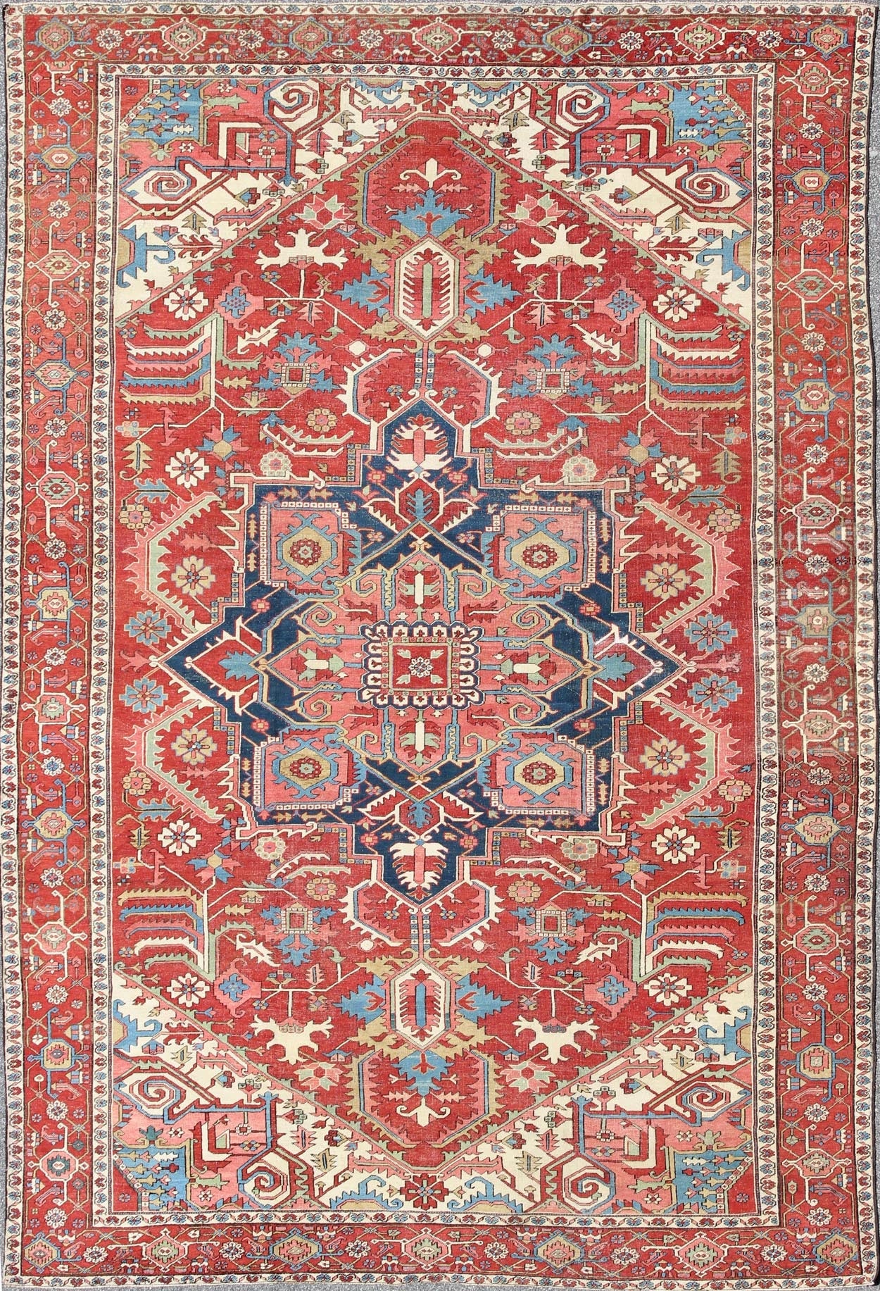 Antique Persian Serapi Carpet in Warm Red, Ivory, and Blue With Geometric Design. Keivan Woven Arts; rug TRA - 1010, country of origin / type: Iran / Serapi, circa 1900. Measures: 10'4 x 15'. This antique Persian Serapi carpet displays a wonderful... - Keivan Woven ArtsTRA - 1010 - 2567Rug