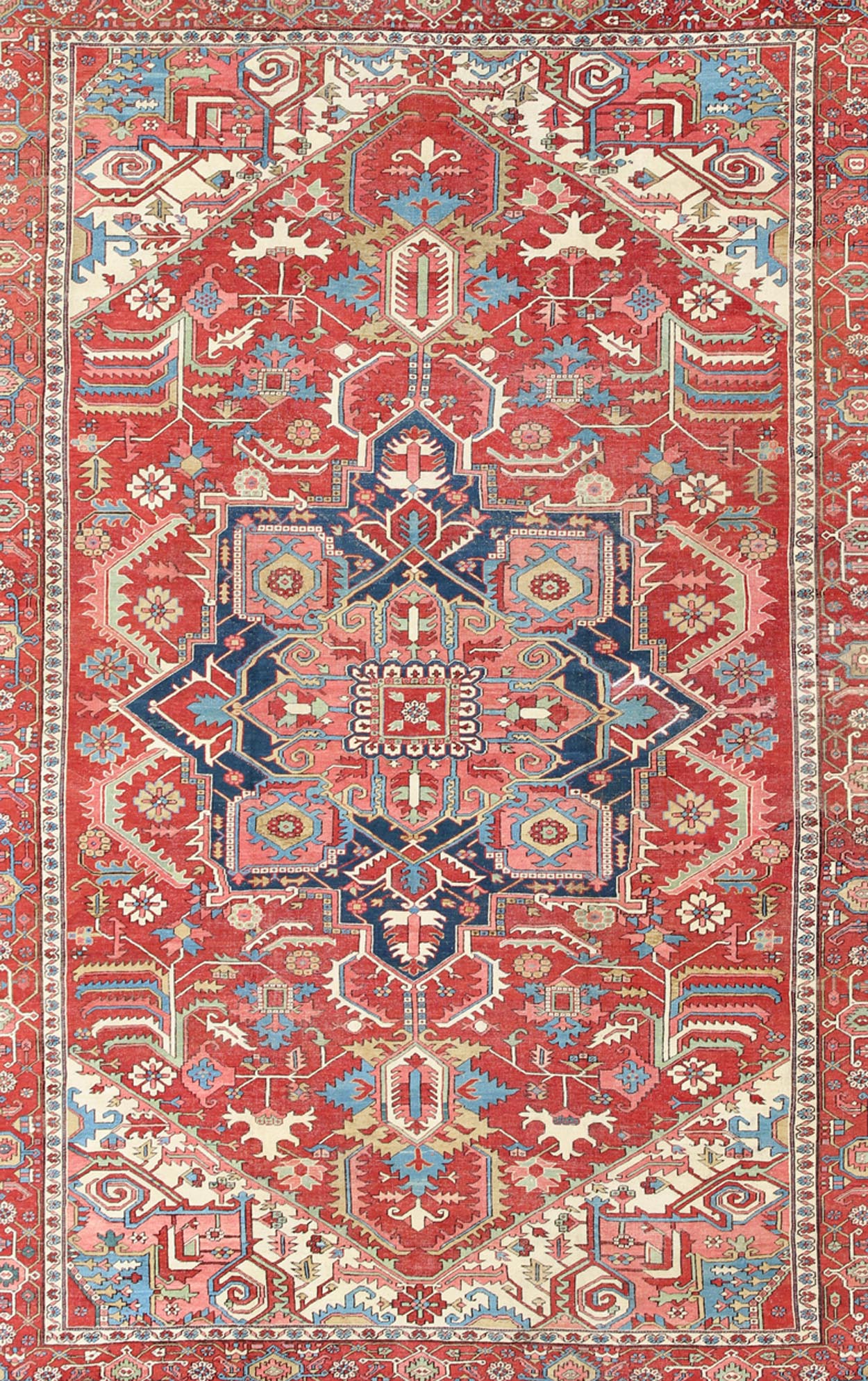 Antique Persian Serapi Carpet in Warm Red, Ivory, and Blue With Geometric Design. Keivan Woven Arts; rug TRA - 1010, country of origin / type: Iran / Serapi, circa 1900. Measures: 10'4 x 15'. This antique Persian Serapi carpet displays a wonderful... - Keivan Woven ArtsTRA - 1010 - 2567Rug