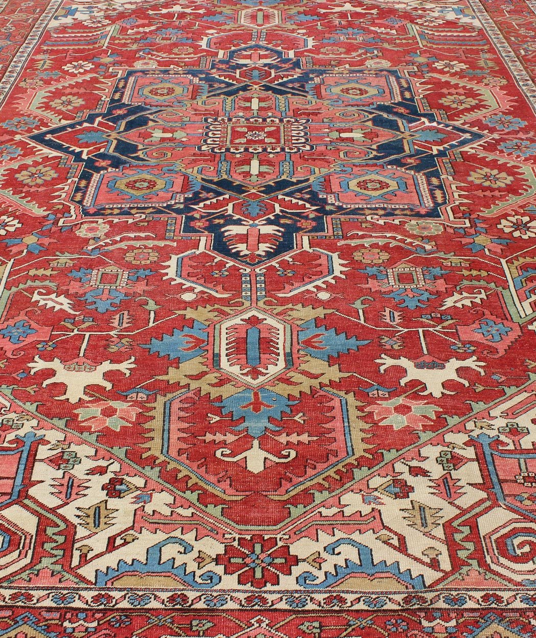 Antique Persian Serapi Carpet in Warm Red, Ivory, and Blue With Geometric Design. Keivan Woven Arts; rug TRA - 1010, country of origin / type: Iran / Serapi, circa 1900. Measures: 10'4 x 15'. This antique Persian Serapi carpet displays a wonderful... - Keivan Woven ArtsTRA - 1010 - 2567Rug
