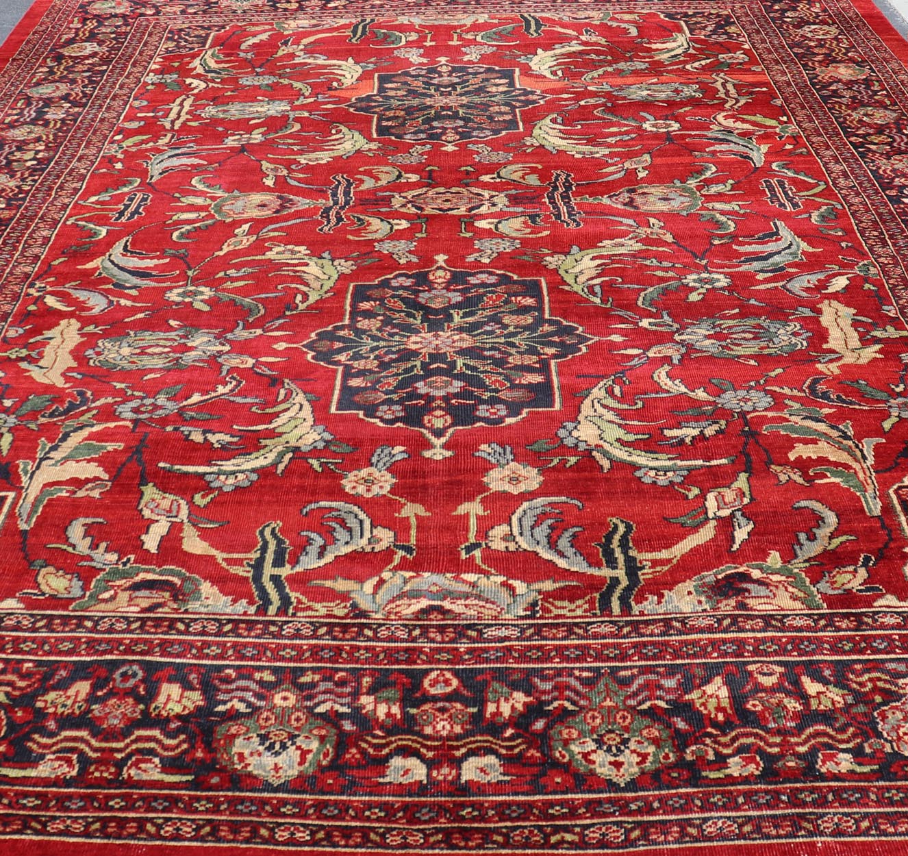 Antique Persian Ziegler Sultanabad Rug with Botanical Elements Set on Red Field. Keivan Woven Arts / rug TRA - 120701, country of origin / type: Iran / Ziegler Sultanabad, circa 1900. Antique Ziegler, Antique Sultanabad Measures: 12'3 x 18'3. Thi... - Keivan Woven ArtsTRA - 120701 - 3285Rug