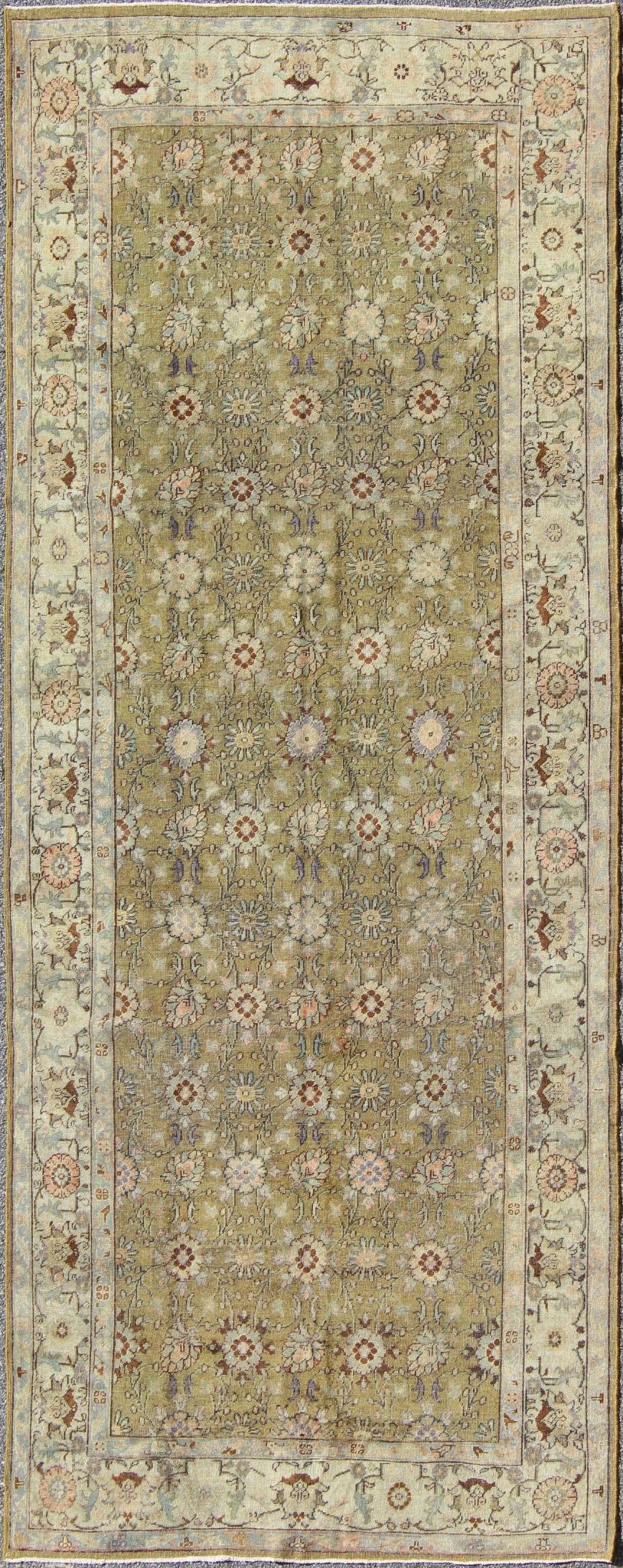 This broad antique Turkish Oushak runner is remarkably elegant in both color and design. The central field of olive green plays host to a variety interconnected blossoms in an all - over pattern with intermixed palmette motifs. The simplified inner and o... - Keivan Woven ArtsTU - CUM - 148 - 2400Rug