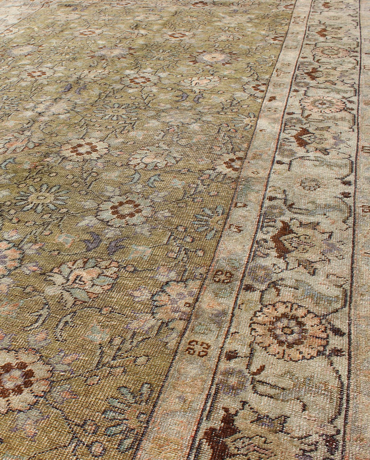 This broad antique Turkish Oushak runner is remarkably elegant in both color and design. The central field of olive green plays host to a variety interconnected blossoms in an all - over pattern with intermixed palmette motifs. The simplified inner and o... - Keivan Woven ArtsTU - CUM - 148 - 2400Rug