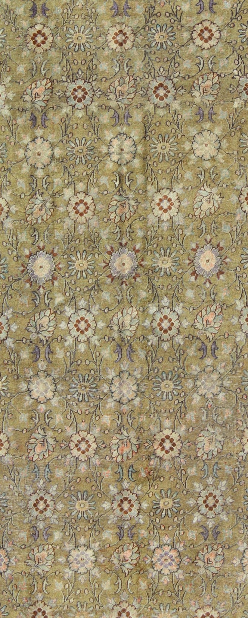 This broad antique Turkish Oushak runner is remarkably elegant in both color and design. The central field of olive green plays host to a variety interconnected blossoms in an all - over pattern with intermixed palmette motifs. The simplified inner and o... - Keivan Woven ArtsTU - CUM - 148 - 2400Rug