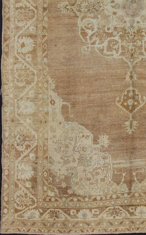 Brown and Ivory Vintage Turkish Rug with Flowers and Elegant Medallion Measures: 7'0'' x 12'5''. This vintage Turkish carpet, (circa mid - 20th century) features an elegant central medallion design, as well as patterns of smaller flowers and fl... - Keivan Woven ArtsTU - DUR - 3478 - 7225Rug