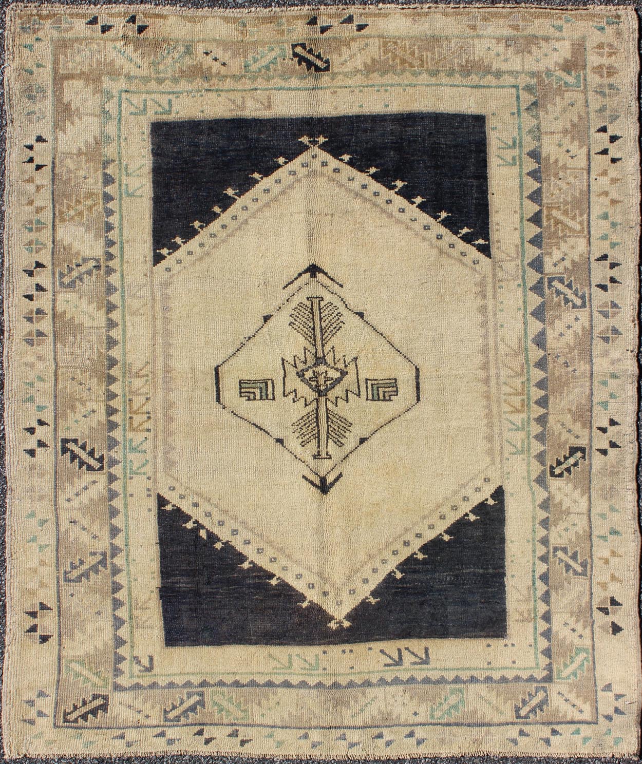 Vintage Turkish Oushak Rug with Central Medallion in Cream and Blue This beautiful rug from mid - 20th century is on a cream ground and home to the center medallion. Three ornate borders with arrows and variegated leaf patterns coordinate wit... - Keivan Woven ArtsTU - DUR - 3691 - 7899Rug