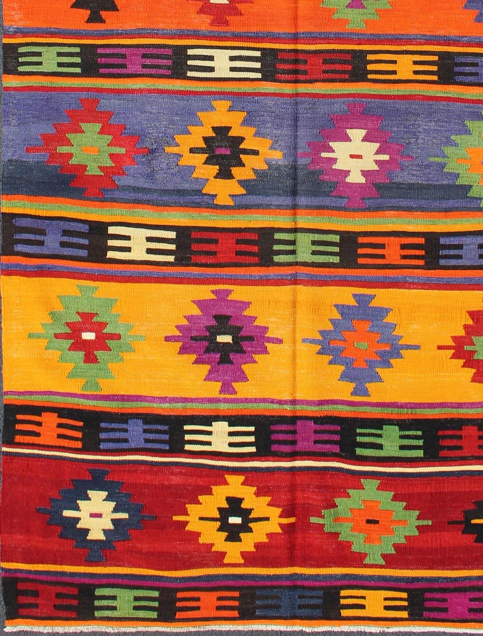 Colorful and Vibrant Turkish Vintage Kilim Rug with Repeating Diamond Pattern: This brilliant and colorful Turkish Kilim rug has a repeating diamond pattern, which is articulated on a background of thick bands of alternating color. This piece is vibran... - Keivan Woven ArtsTU - EMD - 95035 - 3477Rug