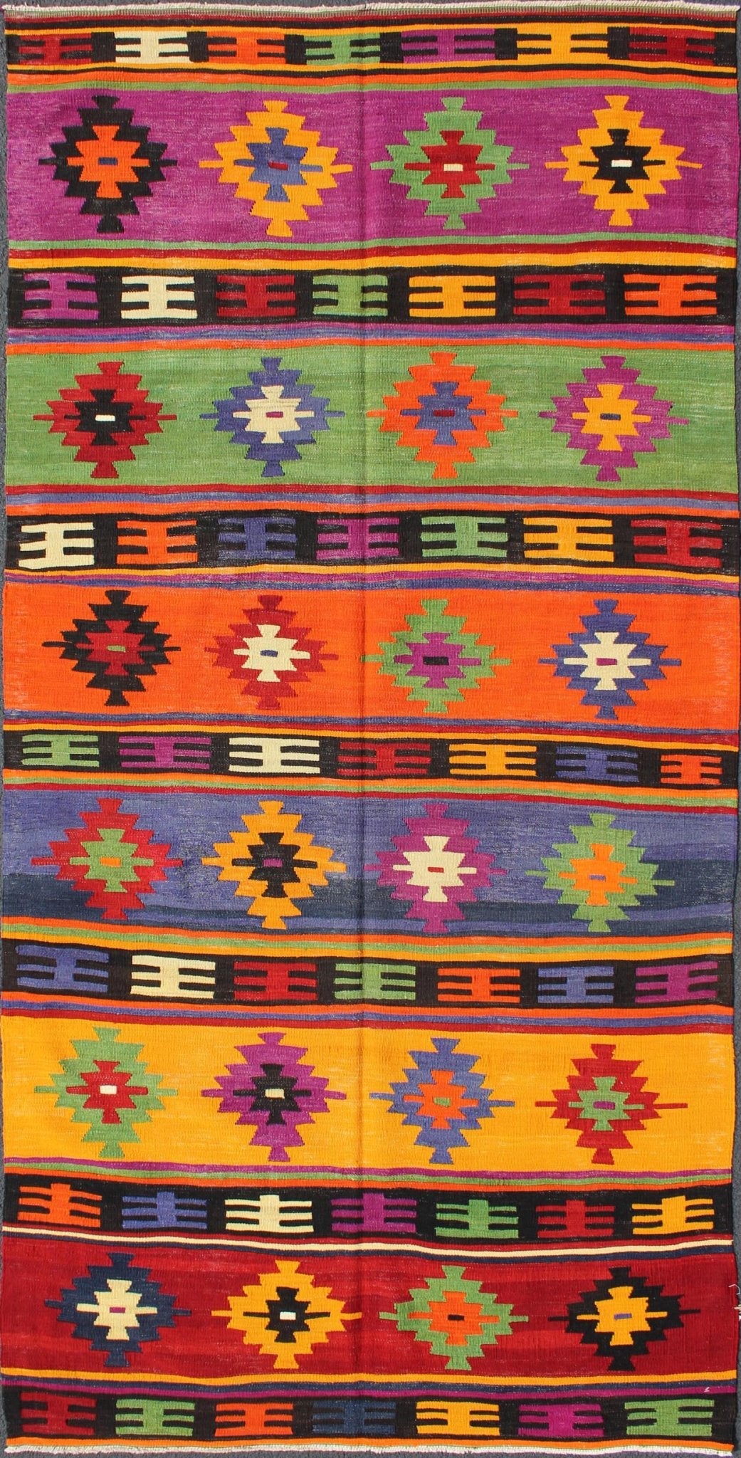 Colorful and Vibrant Turkish Vintage Kilim Rug with Repeating Diamond Pattern: This brilliant and colorful Turkish Kilim rug has a repeating diamond pattern, which is articulated on a background of thick bands of alternating color. This piece is vibran... - Keivan Woven ArtsTU - EMD - 95035 - 3477Rug