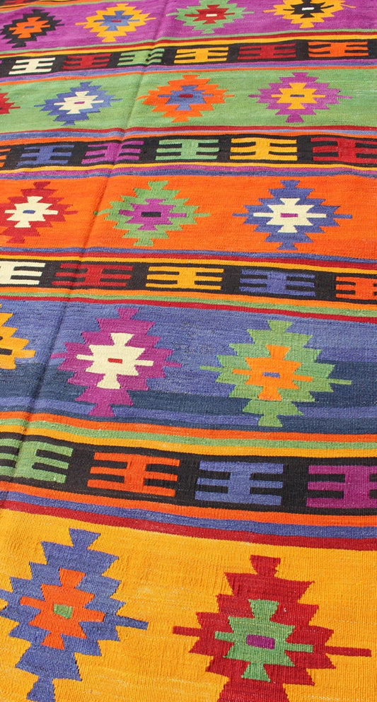 Colorful and Vibrant Turkish Vintage Kilim Rug with Repeating Diamond Pattern: This brilliant and colorful Turkish Kilim rug has a repeating diamond pattern, which is articulated on a background of thick bands of alternating color. This piece is vibran... - Keivan Woven ArtsTU - EMD - 95035 - 3477