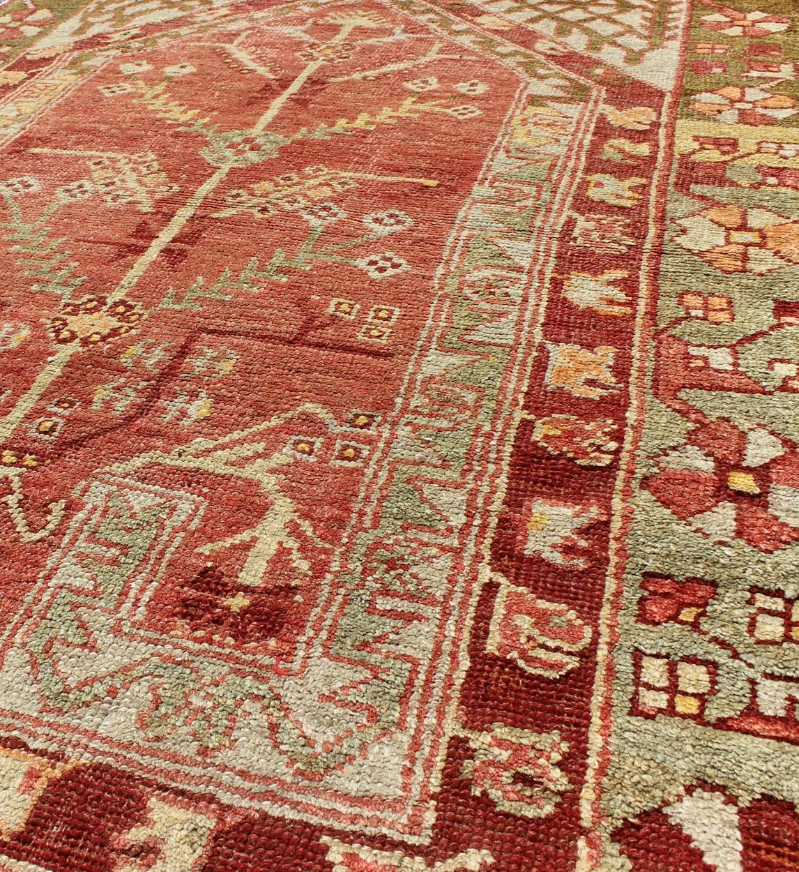 Antique Oushak Rug From Turkey With Directional Tribal Motifs in Soft Rose Red, Green. Antique Oushak Rug Turkey with Tree and Stems, geometric border & Tribal Motifs Keivan Woven Arts/rug/TU - EYP - 1, origin/Turkey, Circa, 1910's Measures... - Keivan Woven ArtsTU - EYP - 1 - 2105Rug