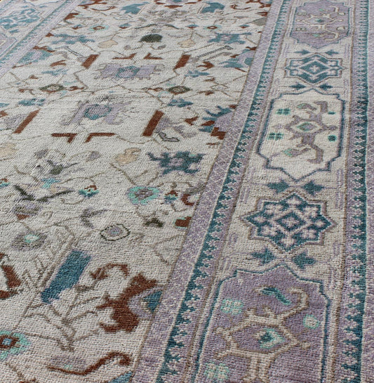 Vintage All - Over Floral Turkish Oushak Area Rug in Cream, Blue, Lilac and Red Measures: 4'4 x 8 This vintage Turkish Oushak carpet (circa mid - 20th century) features an all - over design of sub - geometric floral motifs atop of a creamy backgr... - Keivan Woven ArtsTU - IHS - 123347 - 3638