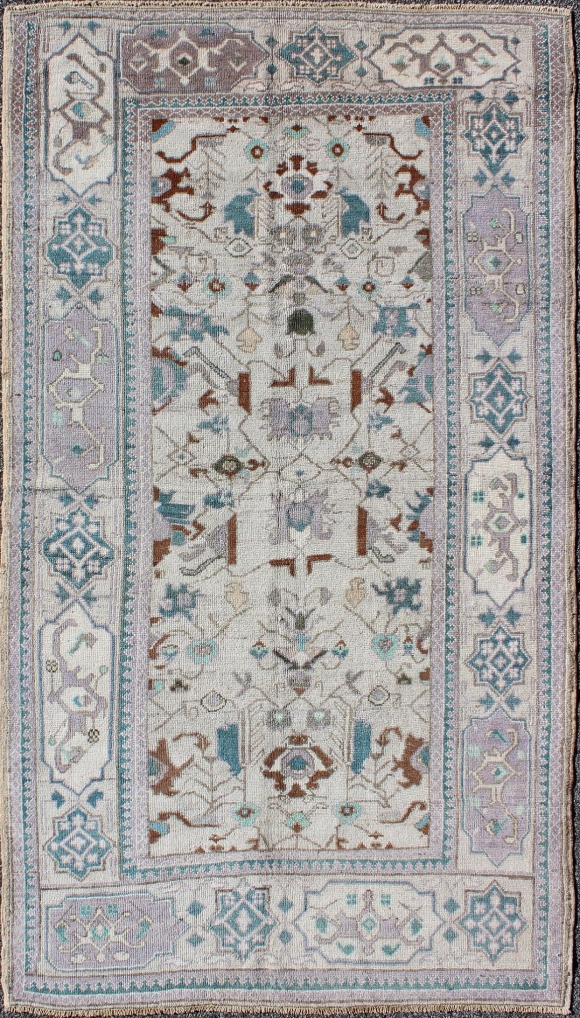 Vintage All - Over Floral Turkish Oushak Area Rug in Cream, Blue, Lilac and Red Measures: 4'4 x 8 This vintage Turkish Oushak carpet (circa mid - 20th century) features an all - over design of sub - geometric floral motifs atop of a creamy backgr... - Keivan Woven ArtsTU - IHS - 123347 - 3638Rug