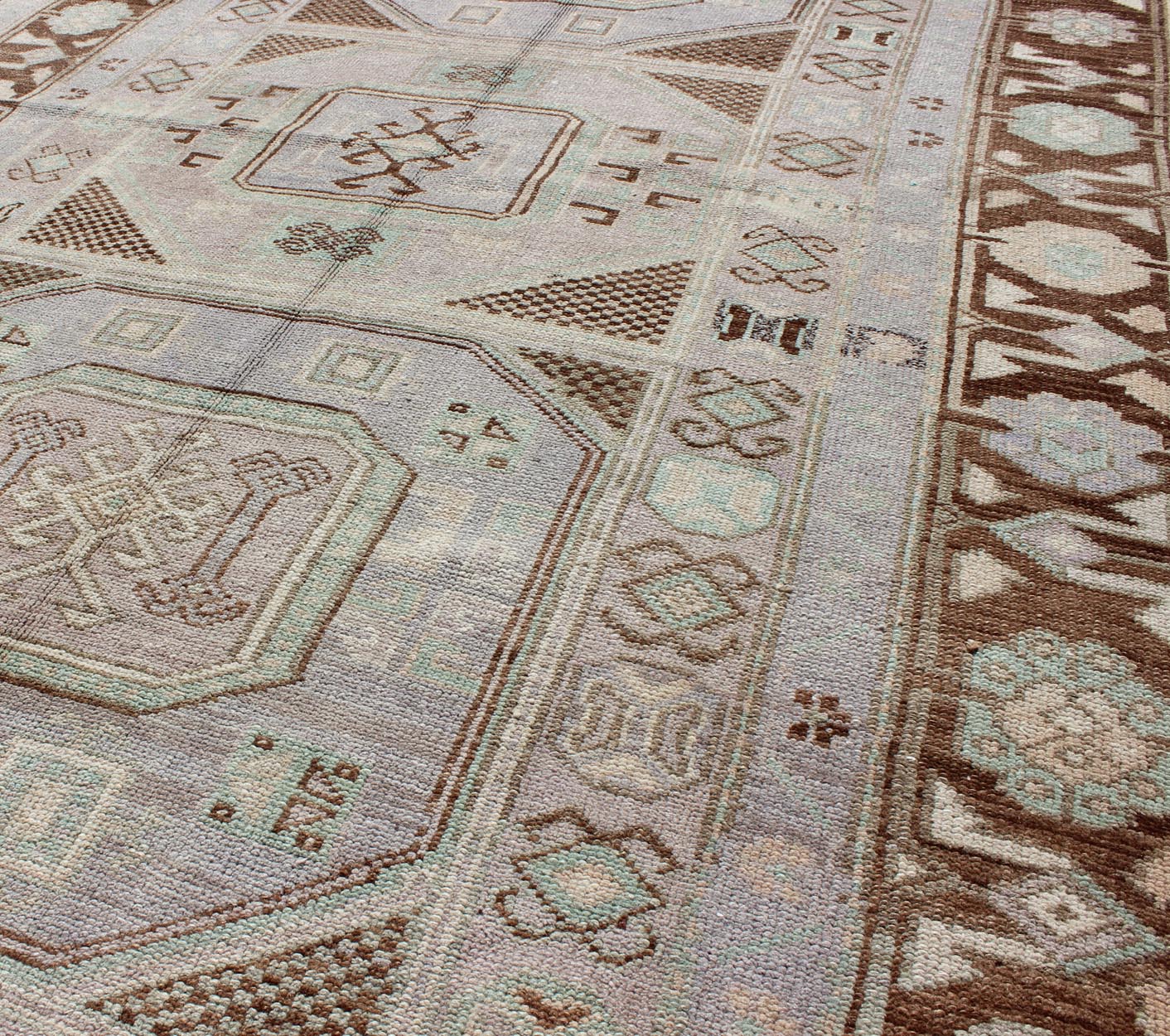 Lavender and teal vintage Turkish Oushak rug with tribal / geometric medallions. Keivan Woven Arts / rug TU - IHS - 95156, country of origin type: Turkey Oushak, circa mid - 20th century The lavender background of this vintage Oushak rug from Turkey (... - Keivan Woven ArtsTU - IHS - 95156 - 4554Rug