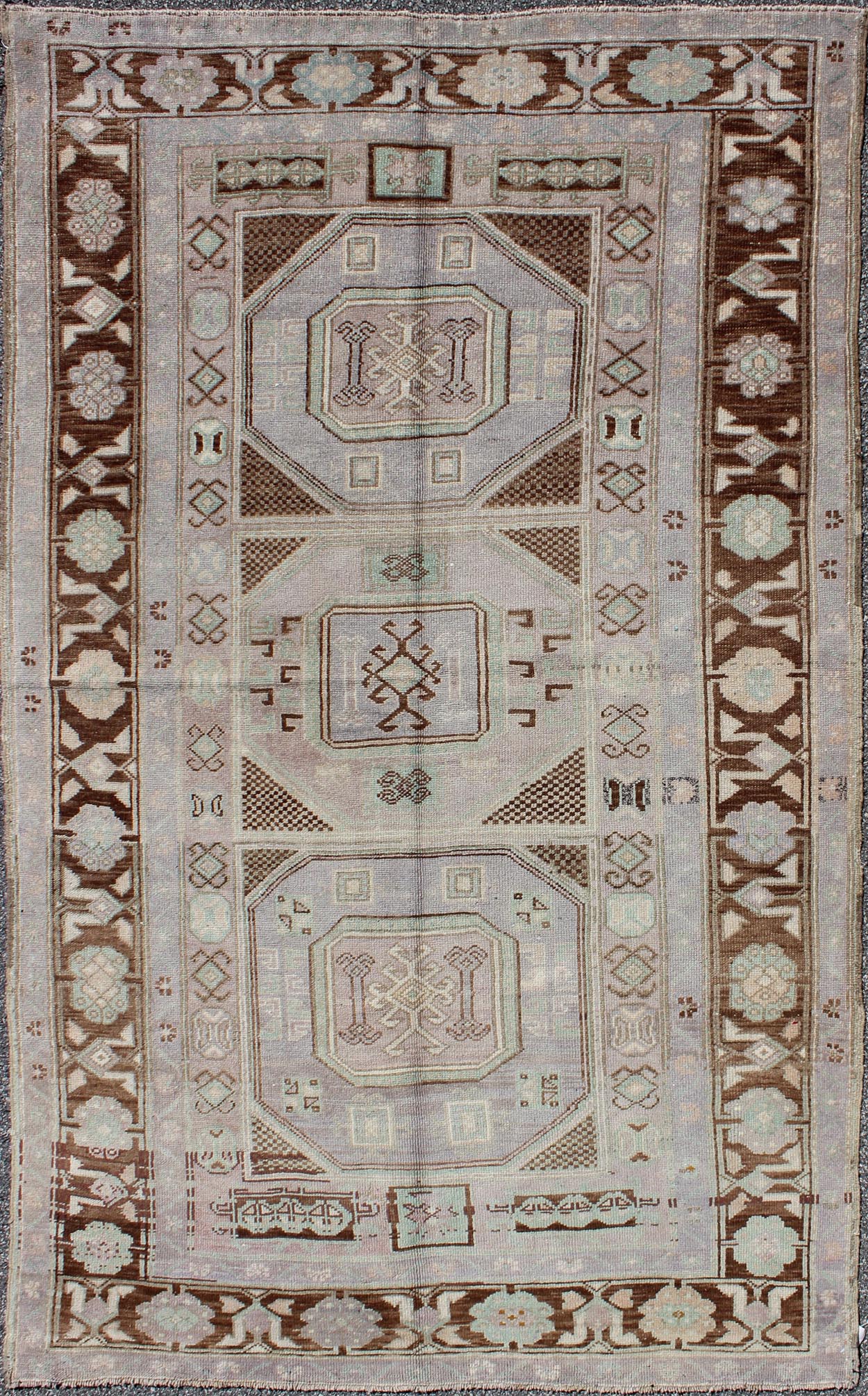 Lavender and teal vintage Turkish Oushak rug with tribal / geometric medallions. Keivan Woven Arts / rug TU - IHS - 95156, country of origin type: Turkey Oushak, circa mid - 20th century The lavender background of this vintage Oushak rug from Turkey (... - Keivan Woven ArtsTU - IHS - 95156 - 4554Rug