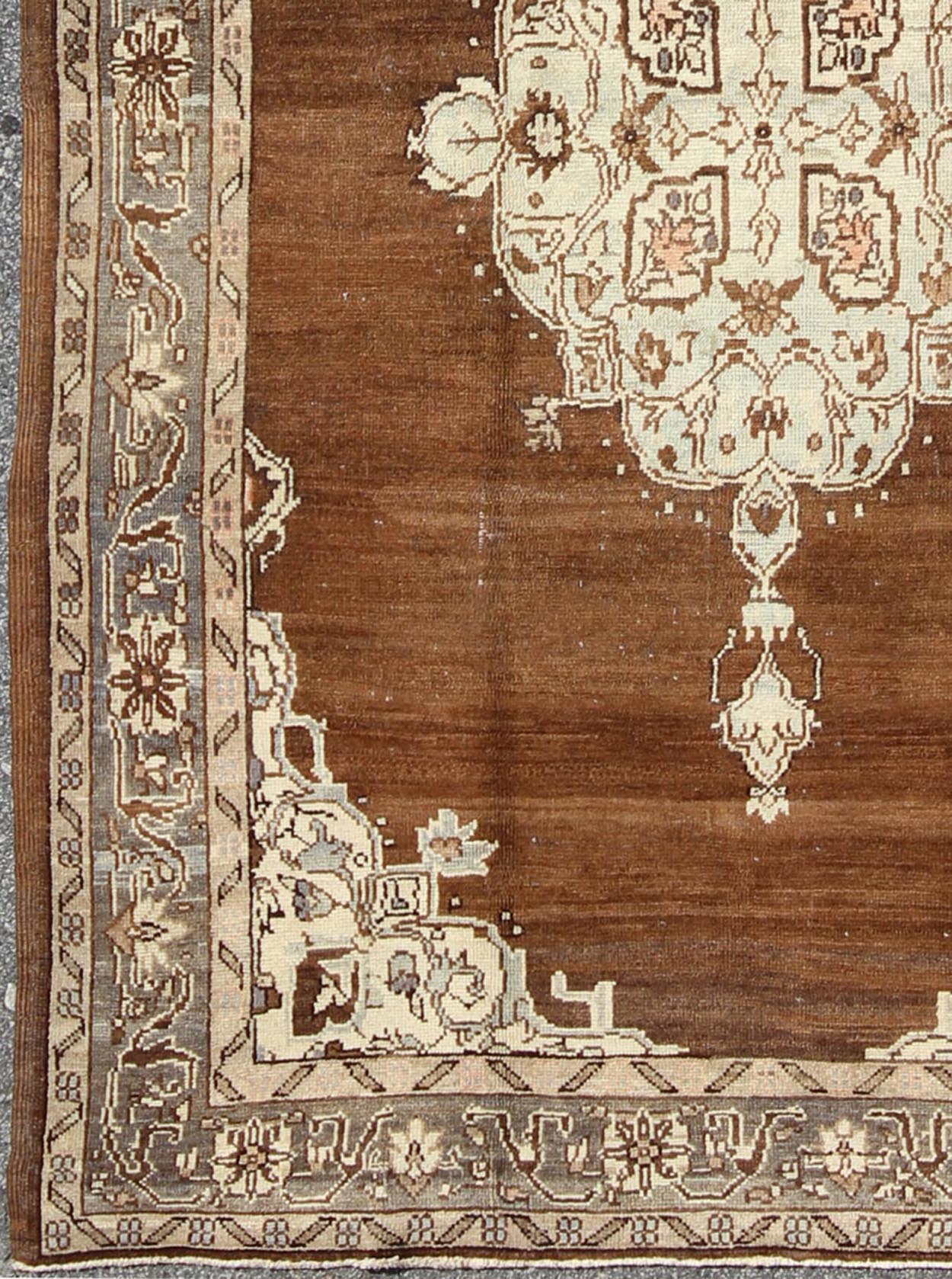 Vintage Turkish Oushak Rug with Floral Motifs in Chocolate Brown, Ivory, Taupe: This beautiful rug from early 20th century Turkey features a Classic Oushak design, which is enhanced by lustrous wool. The chocolate - brown ground is home to the centre med... - Keivan Woven ArtsTU - ISA - 136544 - 5241Rug