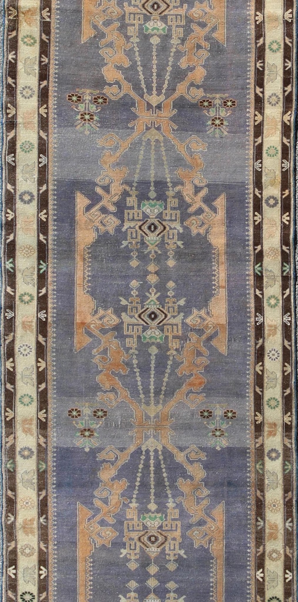 Long Vintage Sivas Runner Bold in design and delicate in colors, this very unique long Turkish Sivas runner rests on a light purple background with three medallions in the center. An ivory main border and two smaller brown guard borders beautifu... - Keivan Woven ArtsTU - MTU - 136064 - 4580Rug