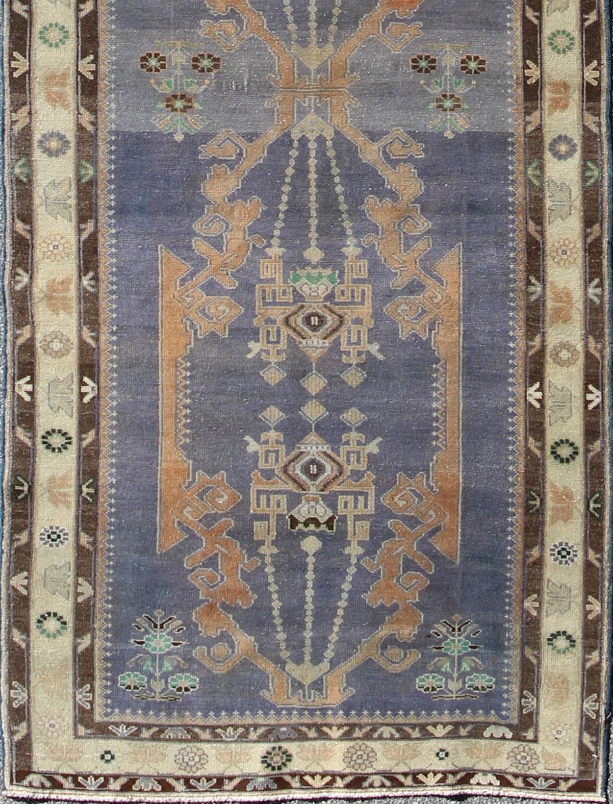 Long Vintage Sivas Runner Bold in design and delicate in colors, this very unique long Turkish Sivas runner rests on a light purple background with three medallions in the center. An ivory main border and two smaller brown guard borders beautifu... - Keivan Woven ArtsTU - MTU - 136064 - 4580Rug