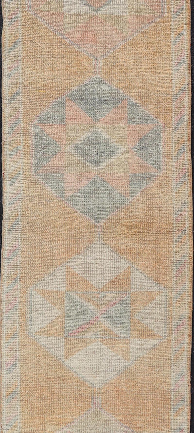 Tribal Medallion Vintage Turkish Oushak Runner in Orange, Blue and Cream Measures: 2'9 x 12'0 This very unique Oushak is uncommon in its design, from the bright and creamy orange background to the angular and sharp medallions center... - Keivan Woven ArtsTU - MTU - 15 - 18728