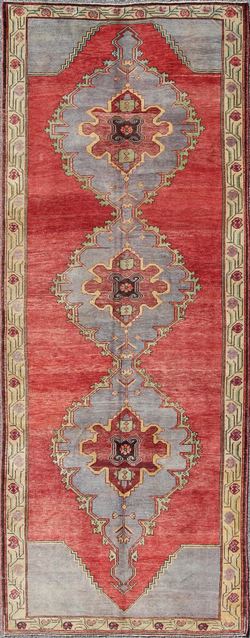 Vintage Turkish Oushak Rug with Three Large Medallions and Vining Floral Border This beautiful vintage Oushak runner from mid - 20th Century Turkey features a Classic Oushak design, which is enhanced by its lustrous wool. The red ground is home to... - Keivan Woven ArtsTU - MTU - 3437 - 5826Rug