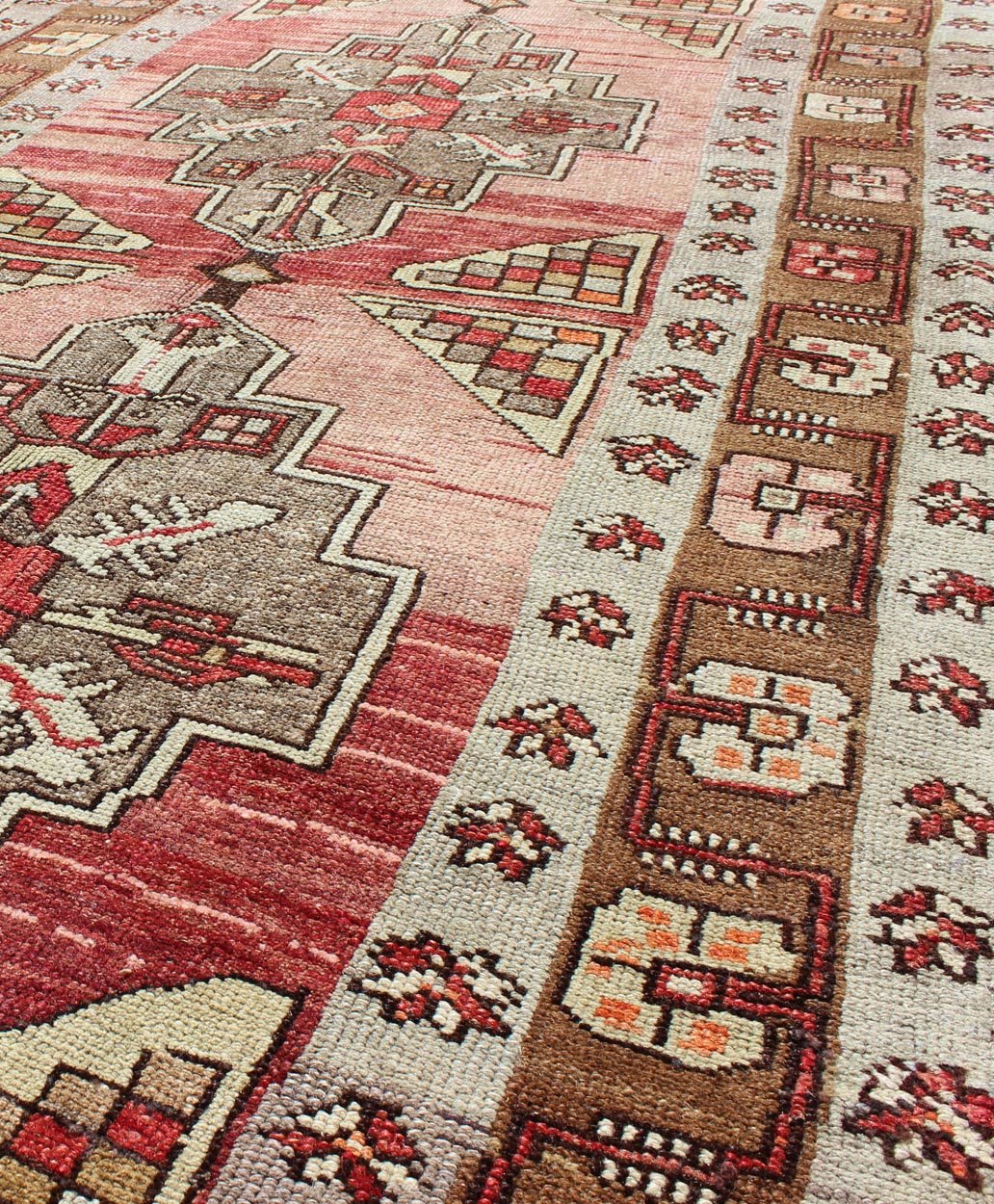 Vintage Turkish Oushak Long Runner with Rose and Pink This vintage Oushak runner contains a unique blend of cheerful colors and an intricately beautiful design. The multi - layered diamond medallions are complemented by a symmetrical set of floral... - Keivan Woven ArtsTU - MTU - 3631 - 6887Rug