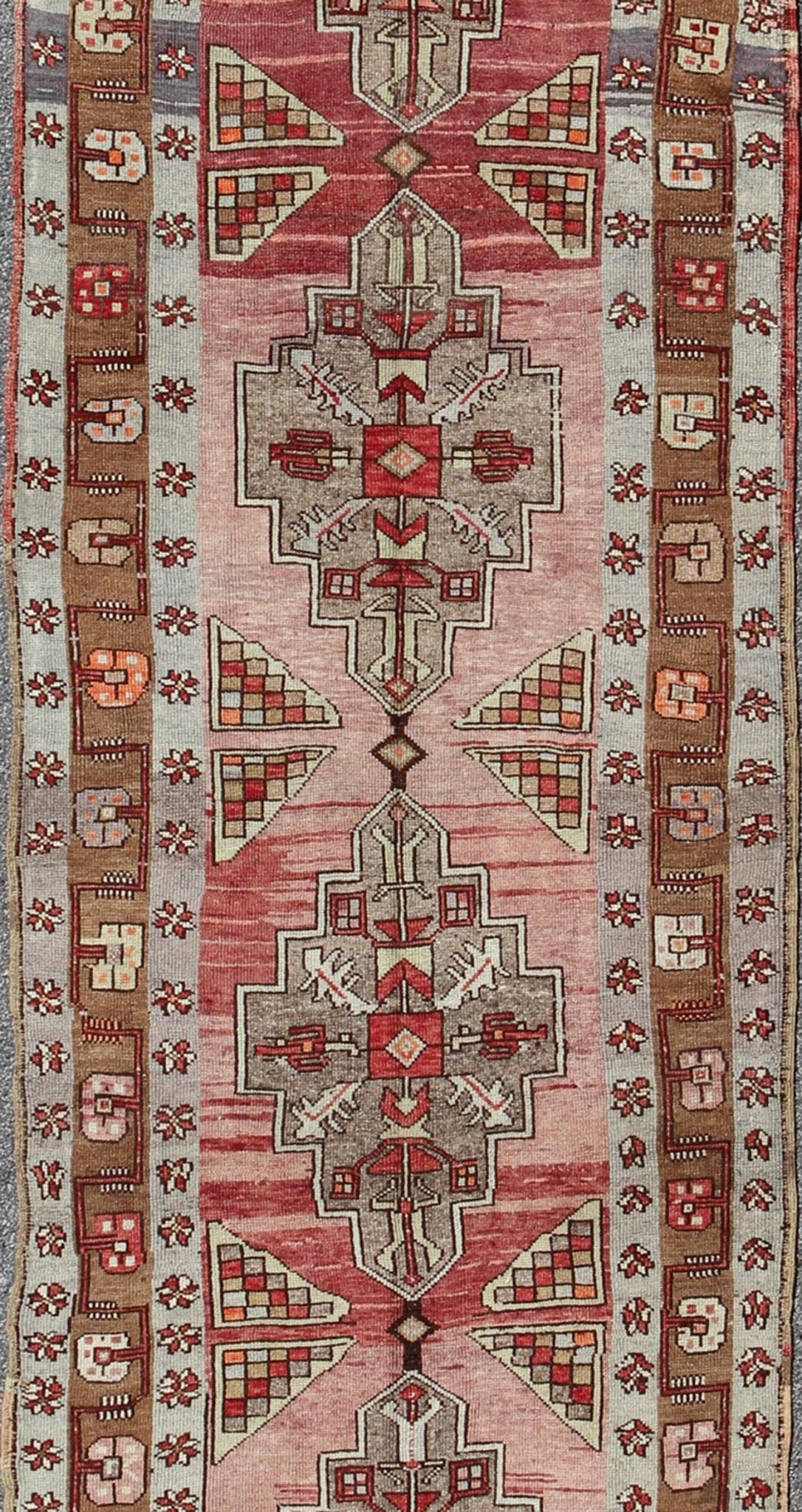 Vintage Turkish Oushak Long Runner with Rose and Pink This vintage Oushak runner contains a unique blend of cheerful colors and an intricately beautiful design. The multi - layered diamond medallions are complemented by a symmetrical set of floral... - Keivan Woven ArtsTU - MTU - 3631 - 6887Rug