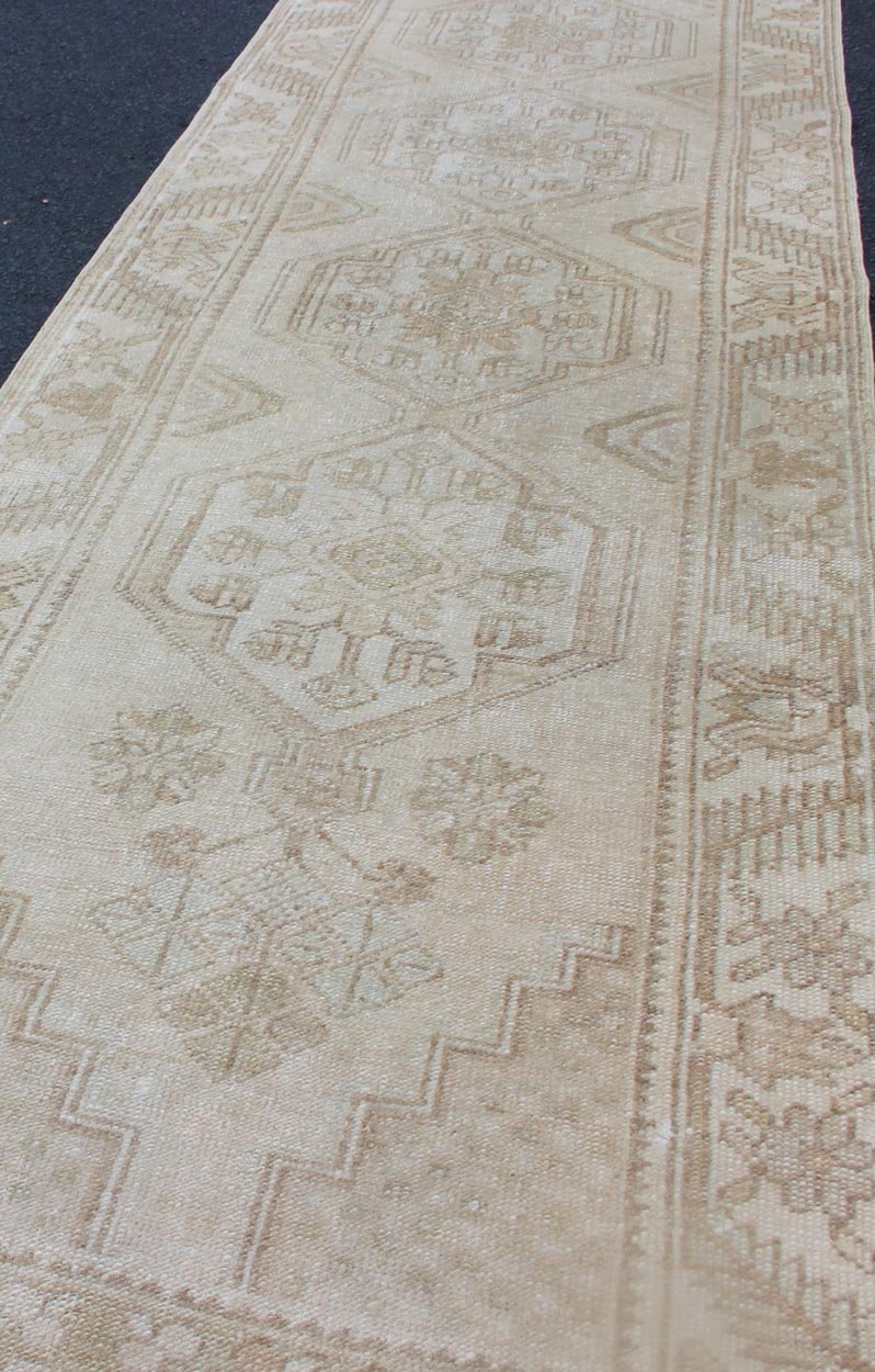Subdued Vintage Hand Knotted Turkish Oushak Runner With Medallions in Soft Cream Lightly toned vintage Turkish Runner with Oushak design, Keivan Woven Arts / rug TU - MTU - 4909, country of origin / type: Turkey / Oushak, circa 1940. This vin... - Keivan Woven ArtsTU - MTU - 4909 - 12148Rug