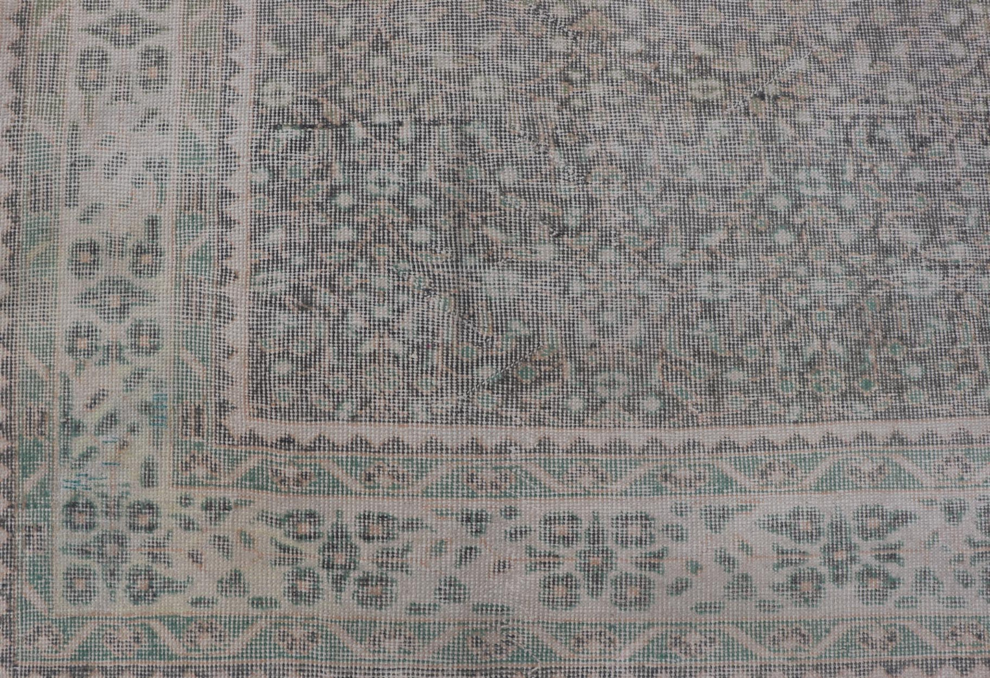 Vintage Hand - Knotted Distressed Turkish Rug in Wool with All - Over Floral Pattern This vintage Turkish Oushak rug has been hand - knotted in wool and features an all - over sub - geometric distressed floral design rendered in cream, blue, green and ivo... - Keivan Woven ArtsTU - MTU - 4962 - 19172