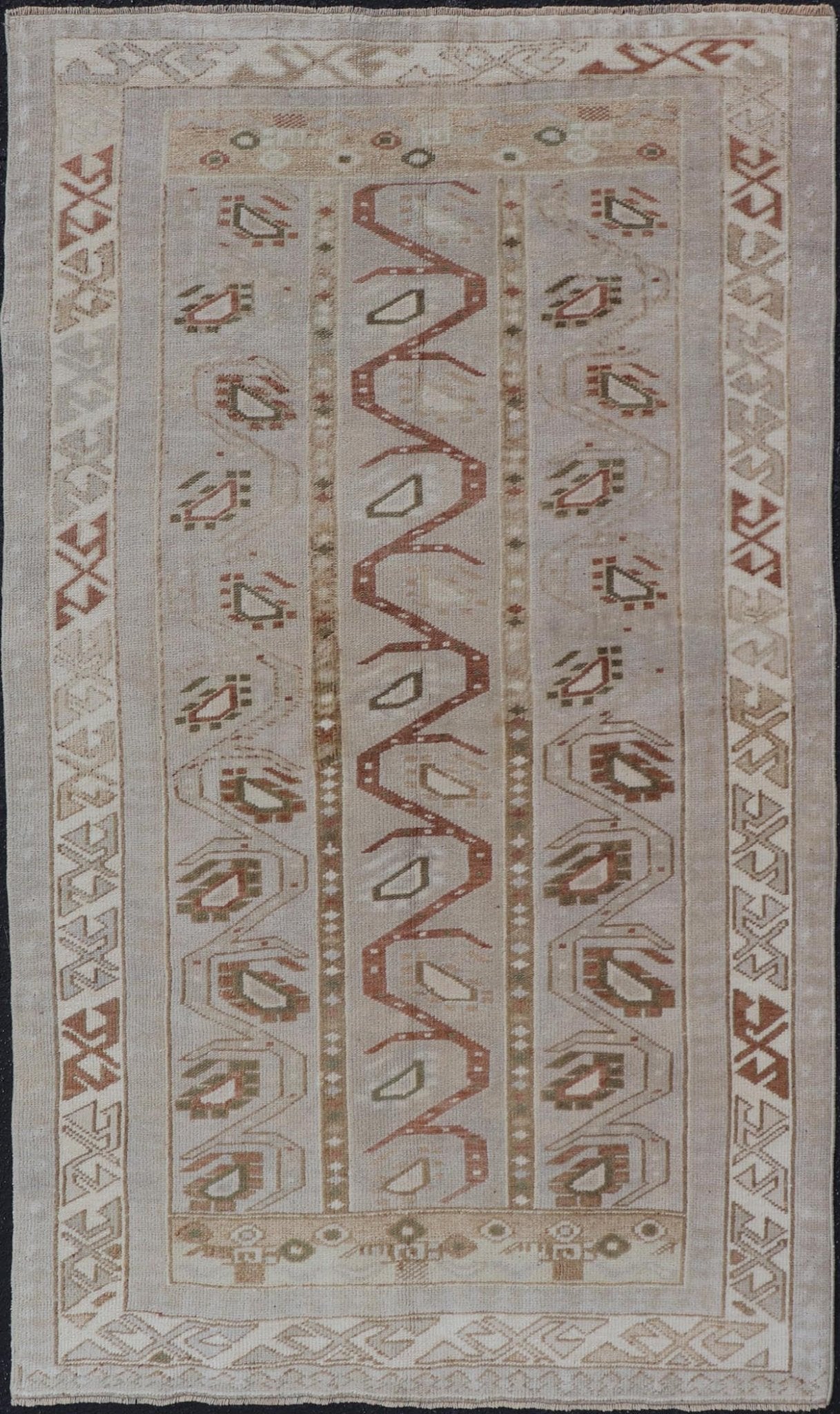 Measures: 3'5 x 6'2 This one - of - a - kind Turkish Oushak has a light taupe colored background reaching the field and the border. The unique tribal designs within the field are rendered in brick red, brown, and forest green. The complimentary borde... - Keivan Woven ArtsTU - MTU - 6003 - 19034