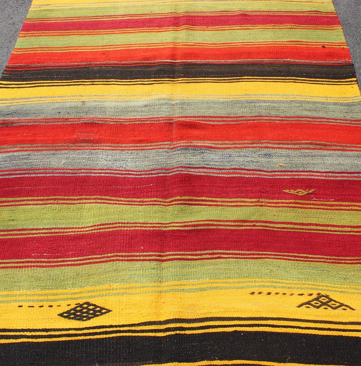 Colorful Vintage Turkish Kilim Rug with Subtle Tribal Shapes and Stripes Design, rug mtu - 95042, country of origin / type: Turkey / Kilim, circa mid - 20th century Featuring a repeating horizontal stripe design, with a few tribal motifs throughout,... - Keivan Woven ArtsTU - MTU - 95042 - 3890Rug