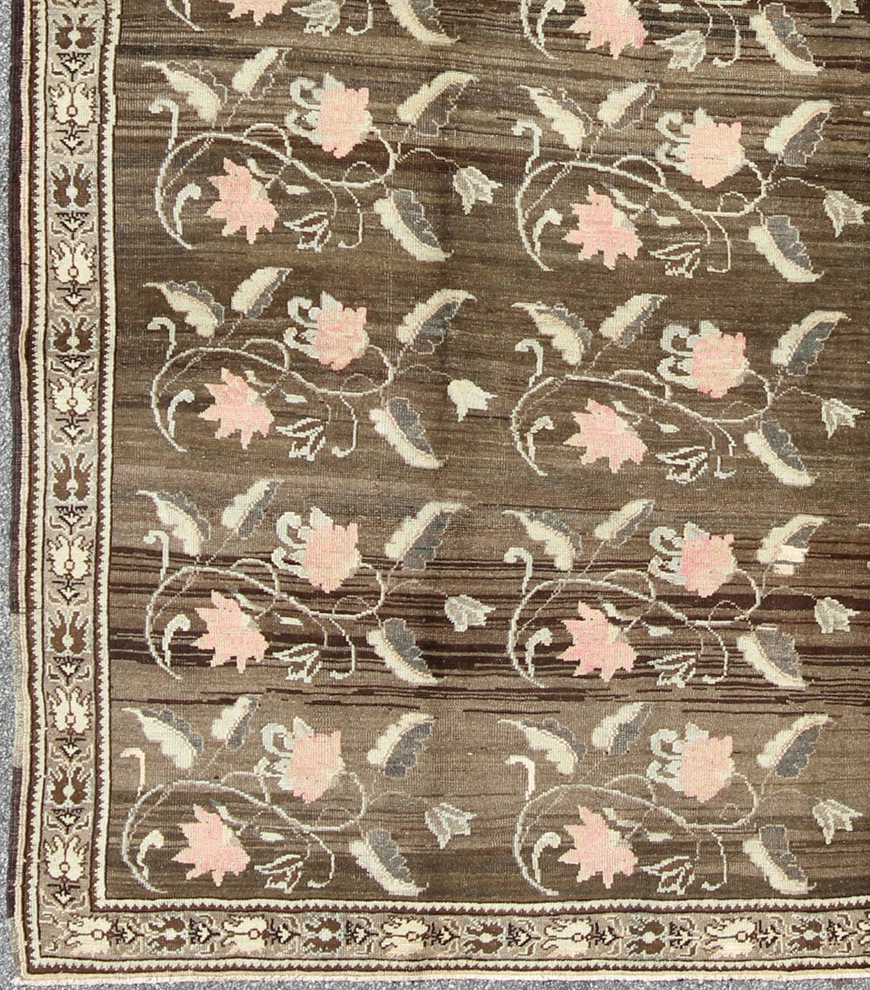 Vintage Kars Rug from Eastern Turkey with Rose Design Brown, Green, and Pink Measures: 7'5 x 11'4 Set on a dark greenish - brown background, the all - encompassing floral pattern of this vintage Turkish Kars is unique. The pale pink and pea... - Keivan Woven ArtsTU - MTU - 95044 - 3904Rug