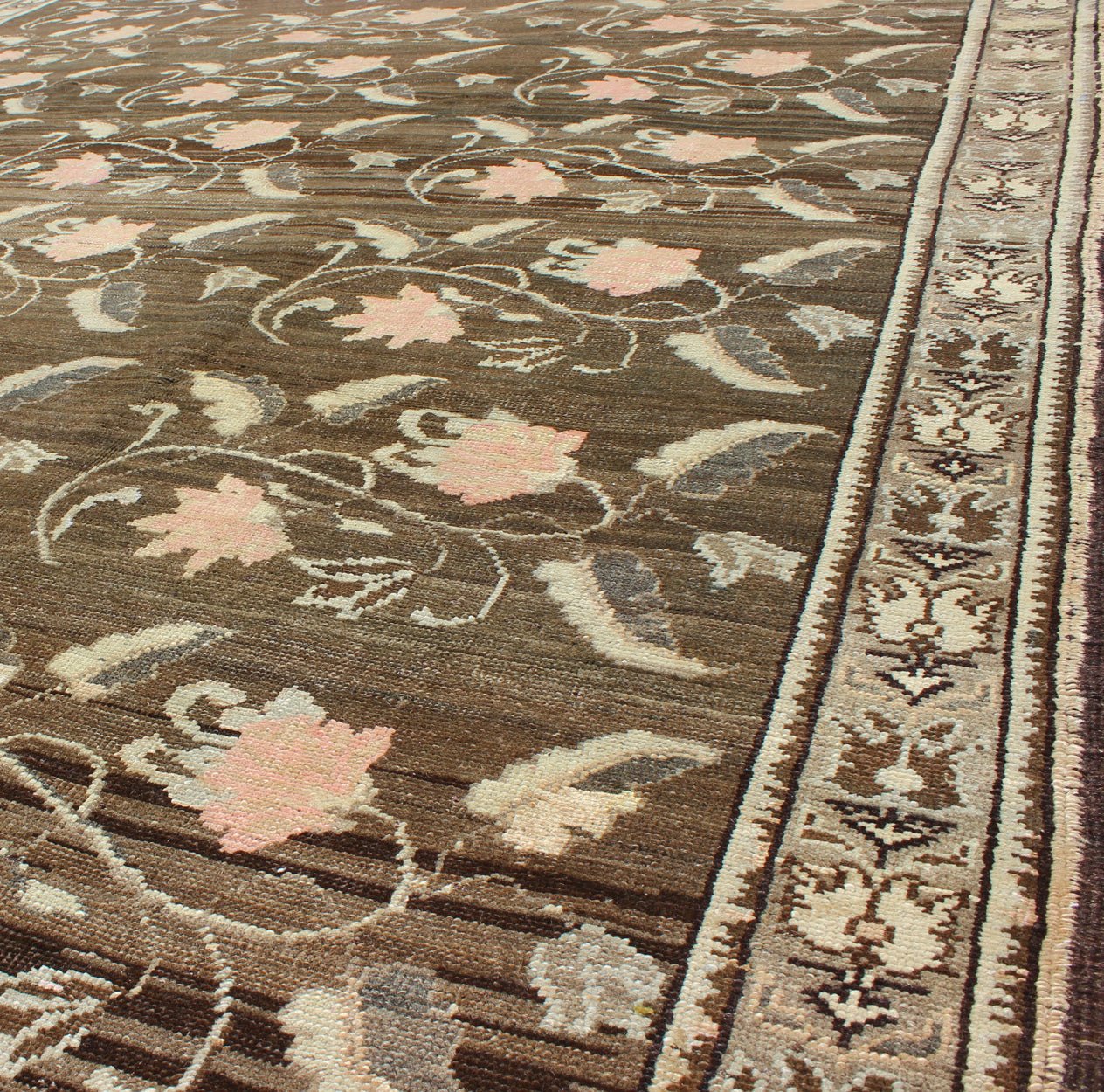 Vintage Kars Rug from Eastern Turkey with Rose Design Brown, Green, and Pink Measures: 7'5 x 11'4 Set on a dark greenish - brown background, the all - encompassing floral pattern of this vintage Turkish Kars is unique. The pale pink and pea... - Keivan Woven ArtsTU - MTU - 95044 - 3904Rug