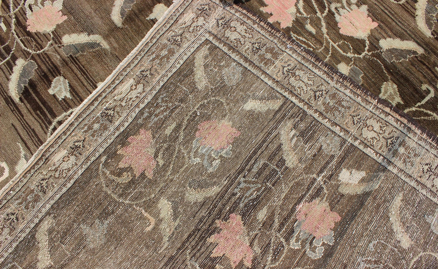 Vintage Kars Rug from Eastern Turkey with Rose Design Brown, Green, and Pink Measures: 7'5 x 11'4 Set on a dark greenish - brown background, the all - encompassing floral pattern of this vintage Turkish Kars is unique. The pale pink and pea... - Keivan Woven ArtsTU - MTU - 95044 - 3904Rug
