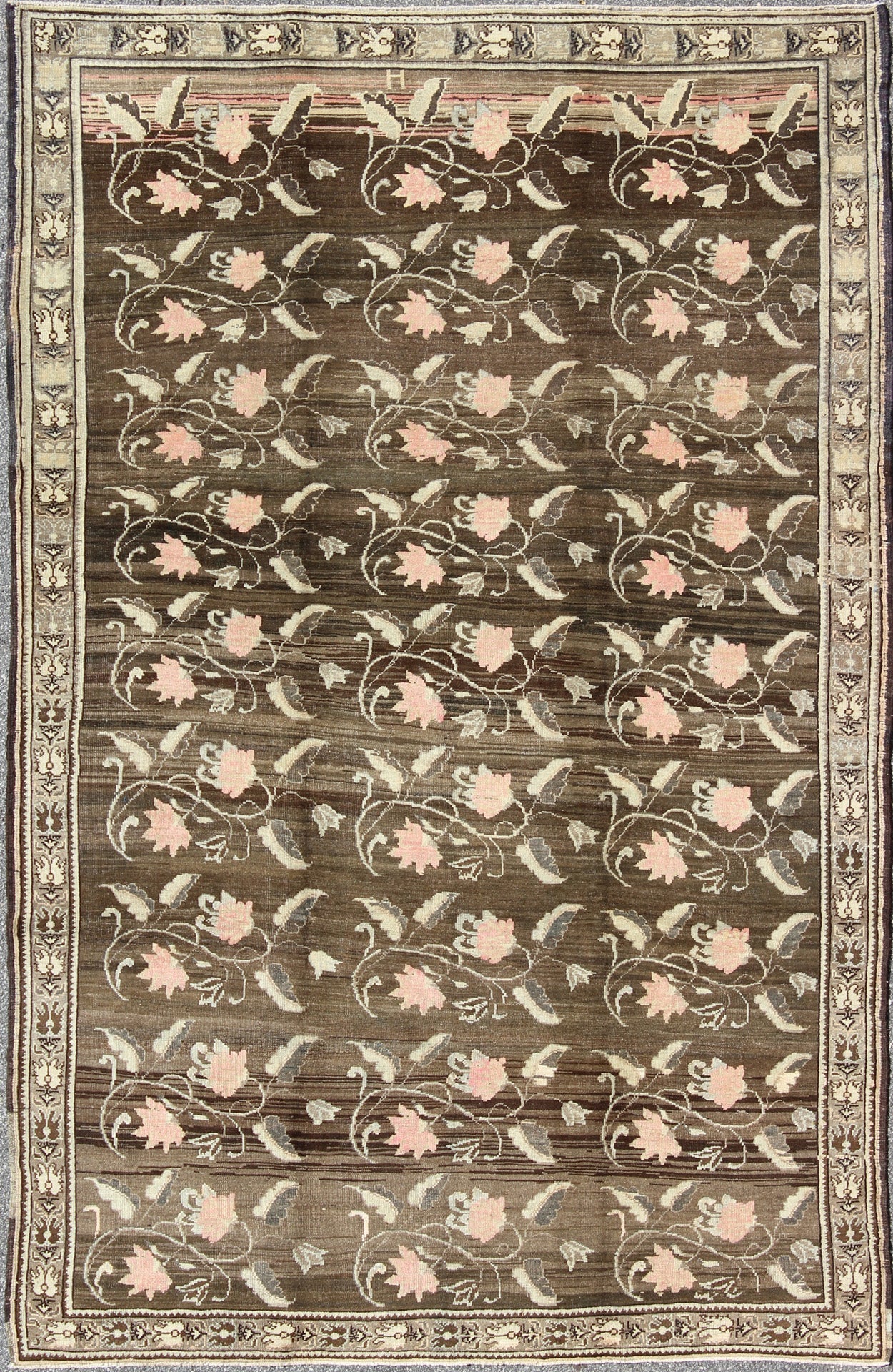Vintage Kars Rug from Eastern Turkey with Rose Design Brown, Green, and Pink Measures: 7'5 x 11'4 Set on a dark greenish - brown background, the all - encompassing floral pattern of this vintage Turkish Kars is unique. The pale pink and pea... - Keivan Woven ArtsTU - MTU - 95044 - 3904Rug